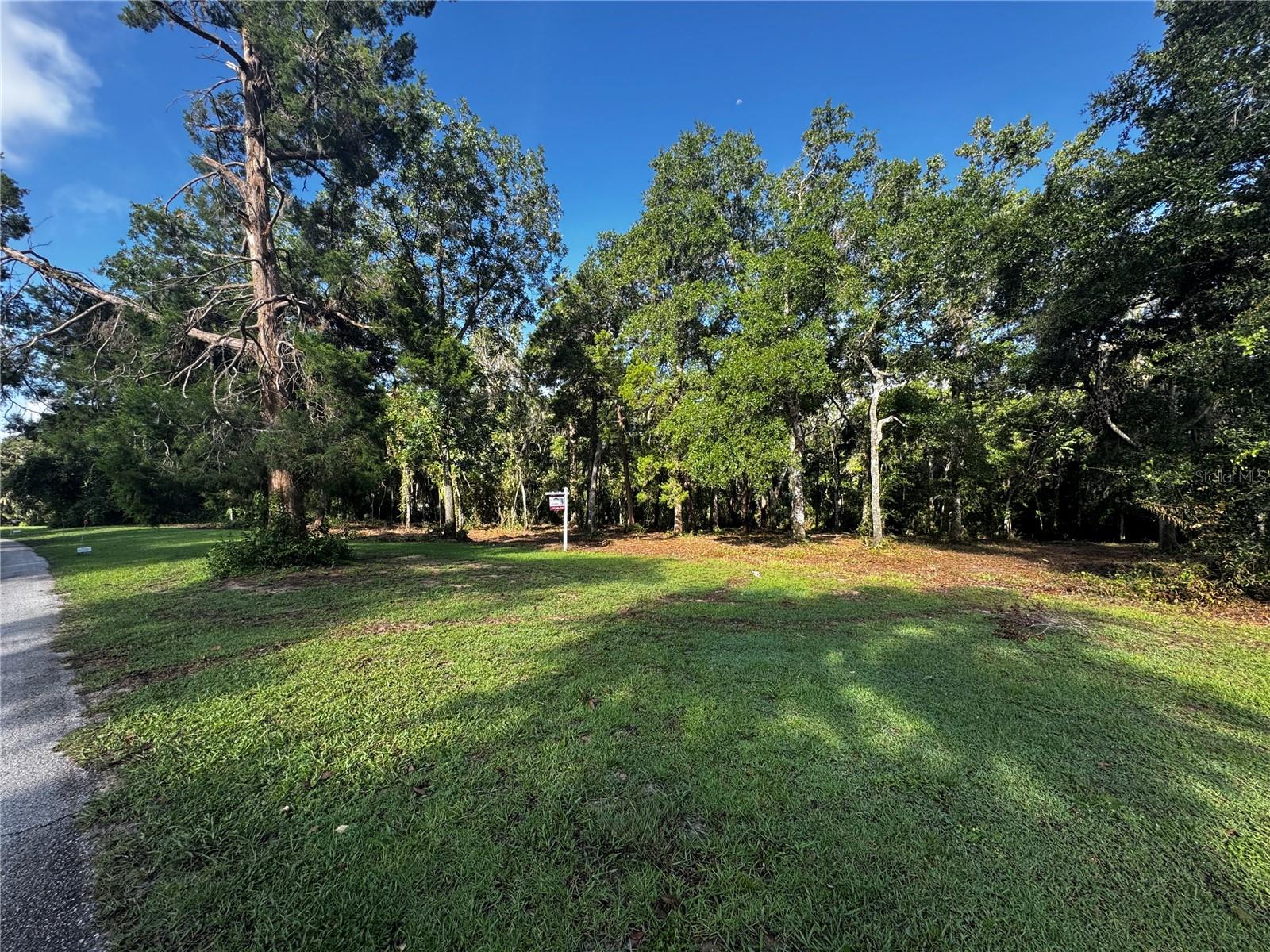 Discover the perfect blend of privacy and convenience with this nearly 5-acre parcel, nestled in one of the area’s most beautiful and desirable neighborhoods. Enjoy peaceful, picturesque surroundings with rolling hills and scenic views, all while being just 5 minutes from I-75 and only 45 minutes to Tampa International Airport. With ample space to build your dream home — and still have plenty of room for all your toys — this lot offers endless possibilities. Whether you’re looking for a private retreat or a place to grow with your family, this is a rare opportunity to own land in a sought-after location that feels like a world away, yet keeps you close to everything you need