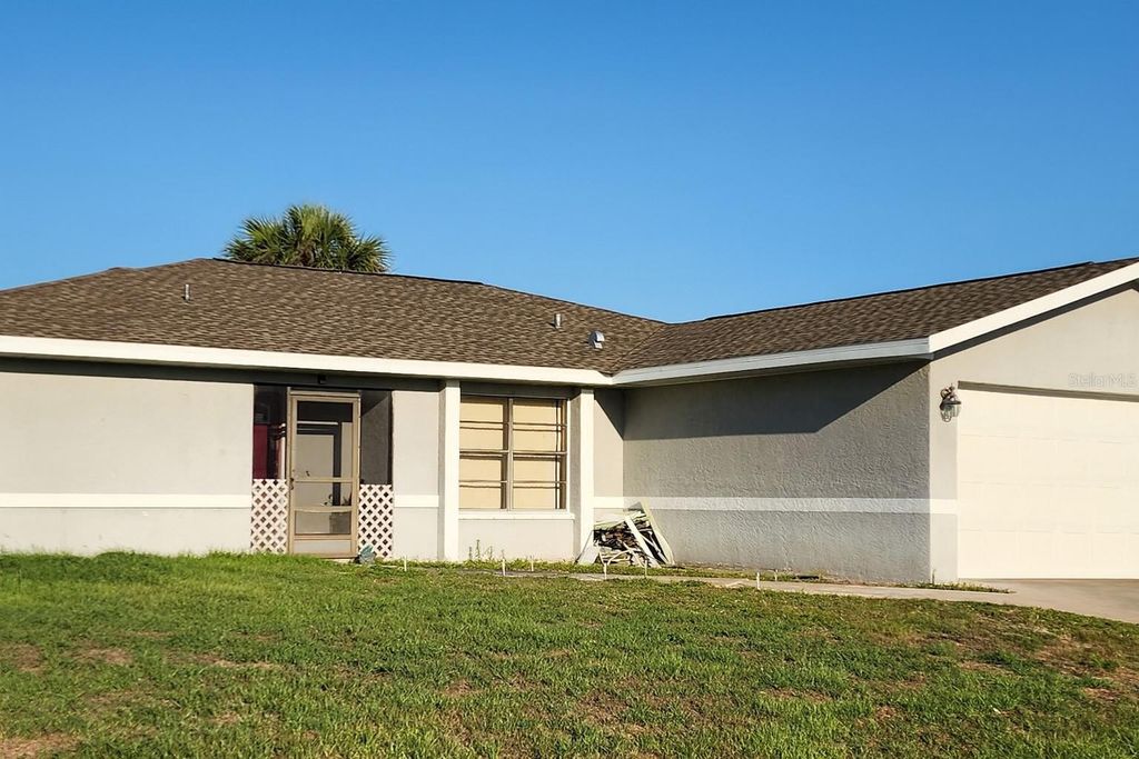 Photo of 113 Lenoir Street NW, Port Charlotte, FL 33948 (MLS # TB8433109)