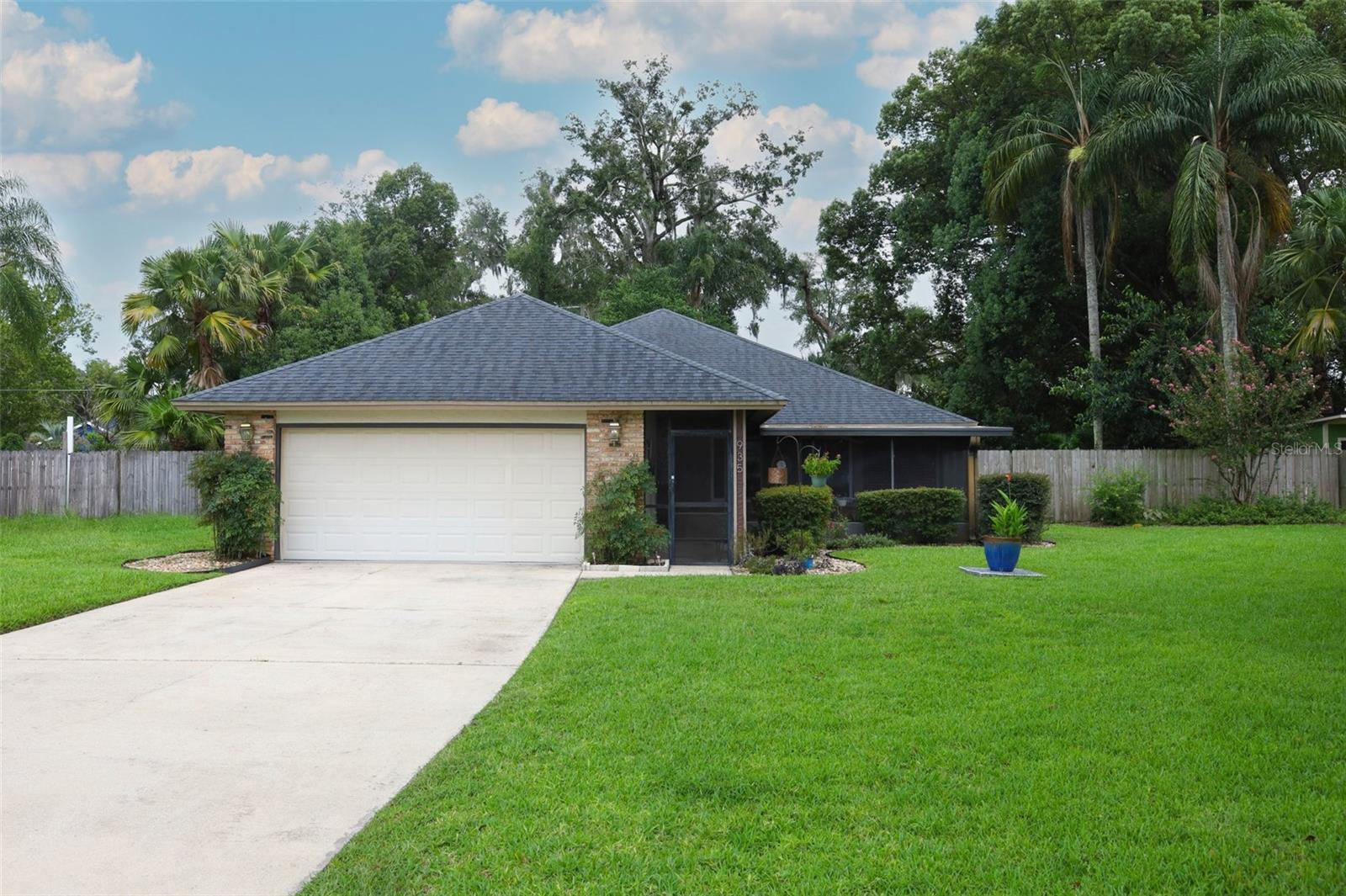 Tucked at the top of a quiet cul-de-sac in a small, private neighborhood, this home is positioned on an oversized lot surrounded by mature shade trees. From the moment you arrive, you’re greeted by a screened front lanai—perfect for morning coffee or evening breezes—and even a screened panel system for the garage door to maximize airflow while you work or play. Inside, the thoughtful split floor plan balances open gathering areas with private retreats. The renovated kitchen, complete with an induction/convection range, overlooks the dining and family room for seamless everyday living and entertaining. Natural light fills the home through large windows, while a clever pocket door off the living area creates separation for the guest wing. This secondary area holds two bedrooms, a full hall bathroom, the laundry room, and additional storage with two linen closets. The primary suite features a spacious ensuite with a renovated bathroom holding a dual sink vanity, walk-in closet, dual-sprayer walk-in shower and direct access to the rear covered lanai. An enclosed bonus sunroom extends your options, ideal as a studio, work-from-home space, or flex retreat with views of the pool. Throughout the home, comfort is enhanced by a carpet-free design for easy living and maintenance. Step outside to enjoy true Florida living. The covered lanai flows into a screened pool area, all bordered by a privacy fence for a secluded atmosphere. Both front and back porches invite alfresco dining. For those who love the outdoors, the property features established raised garden beds of vegetables, herbs, fruits, and flowers—a delight for any gardener. Beyond the property, convenience meets lifestyle. The home is just steps from the Seminole/Wekiva Trail, offering miles of walking, running, and biking opportunities. Located near major highways, commuting to Orlando, Lake Mary, Sanford, or surrounding areas is simple. Excellent medical facilities, parks & recreation, dining, shopping, and entertainment are all close at hand. Schedule your private tour today!