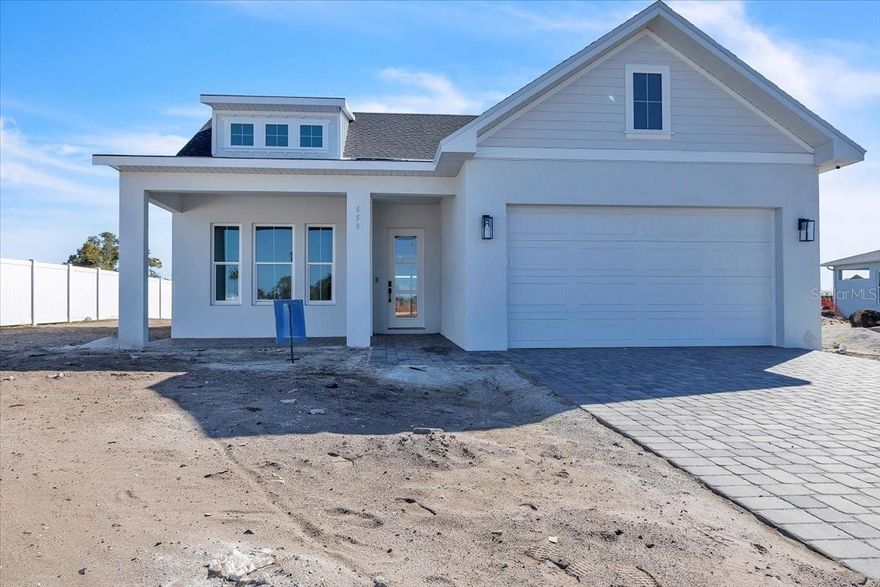 Under Construction. New Construction Estimated Completion April 2026 / MLS# C7521548.  Introducing the award-winning Water’s Edge, a thoughtfully designed 4-bedroom, 3-bath residence located in Gracewater at Sarasota, a new gated community just west of I-75. This spacious floor plan features an inviting great room, tray ceilings in the foyer, and a seamless open-concept layout ideal for both entertaining and everyday living.  Practical design meets elevated style with a dedicated mudroom and laundry area, while upscale finishes include 10-foot ceilings, quartz countertops, and 8-foot interior doors throughout. Impact windows and doors, natural gas appliances, and a tankless hot water heater provide both peace of mind and modern efficiency. Ideally located just 3 miles from downtown Sarasota, Gracewater places you close to world-class beaches, dining, shopping, and cultural destinations. Residents enjoy exclusive access to the Pura Vida Club, featuring a resort-style pool with cabanas, a state-of-the-art fitness center, pickleball courts, and a full calendar of social events curated by a full-time lifestyle manager. Surrounded by palm-lined streets and scenic lakefront views, Gracewater at Sarasota offers a refined lifestyle designed for modern Florida living.