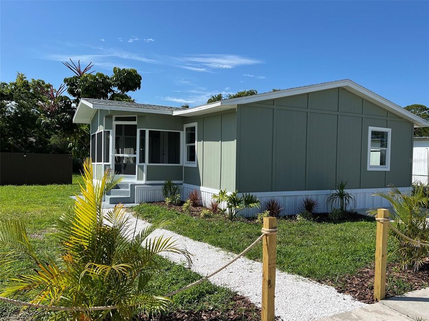 Completely renovated and ready for new owners, you don’t want to miss out on this three bedroom, two bath manufactured home where you own the land. Tons of curb appeal with a beachy feel and colorful fresh landscaping. This home has gone through a complete transformation from the new roof, insulation, Hardie board siding, skirting, and new windows. All your major systems have been replaced including plumbing, new electrical panel, and new HVAC system. As you enter the home from the screened in porch you are greeted with a light and bright open floor plan with vaulted ceilings, a beautiful decorative fireplace, and new wood-looking vinyl plank flooring. All new kitchen cabinets, appliances and countertops, new light fixtures, doors, and bathrooms completely remodeled with new vanities and shower and tub inserts. This home enjoys a split floor plan with a large primary bedroom with walk-in closet and spacious en-suite. The two guest bedrooms also offer plenty of space and walk-in closets.  FHA and VA offers are welcomed. ;Water: City