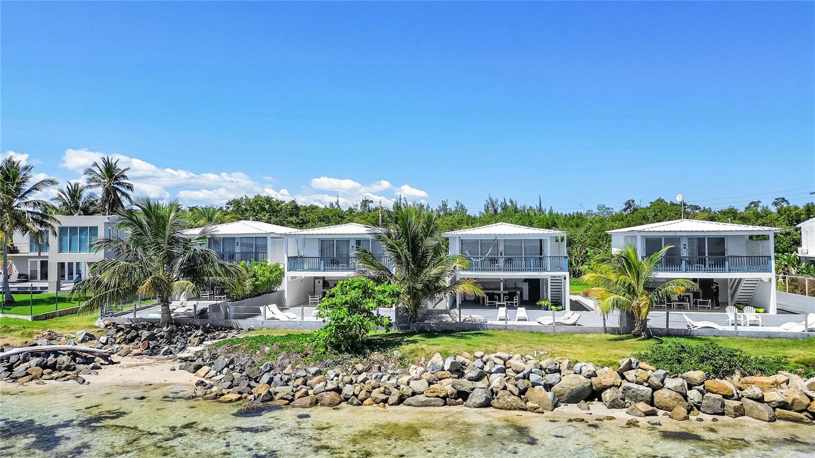 Located in Las Picúas, RÃo Grande, this stunning beachfront estate is a true tropical paradise, offering four separate villas within a gated complex, each with direct beach access. Spanning 6,300 sq. ft. approximately and 2,066 sq meters, the property features a total of 9 bedrooms, 6 full bathrooms, and 6 half bathrooms. The largest, Villa Marcela, boasts 1,800 sq ft aprox., three bedrooms and three and a half bathrooms, with a first floor featuring one bedroom with a full bathroom, a half bath, a fully equipped kitchen, a terrace with a jacuzzi, and a BBQ, while the second floor includes two additional bedrooms, each with its own full bathroom, and a private deck with breathtaking ocean views. Villa Lorena, Villa Manuela, and Villa Renata each boast 1,500 sq ft aprox. and have two bedrooms and three bathrooms (one full, two half), with a first floor featuring a full bathroom, kitchen, terrace with a jacuzzi and BBQ, and a second floor with two bedrooms, each with a half bathroom, plus a deck overlooking the beach. Additional amenities include a generator, private parking, washer and dryer for housekeeping, and all villas come fully furnished with modern décor. Currently generating income. Whether as a luxury residence, vacation rental, or boutique hospitality investment, this exclusive beachfront retreat offers the perfect blend of comfort, style, and income potential in one of Puerto Rico’s most desirable coastal locations.