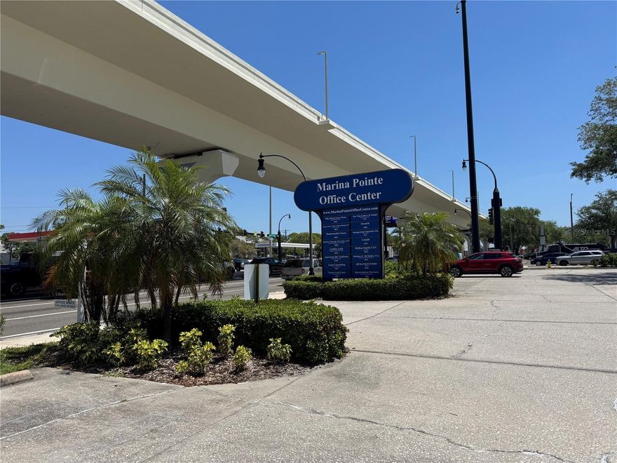 Position your business in the heart of South Tampa at the newly branded Marina Pointe Office Center. Ideally located at the high-traffic intersection of Gandy Boulevard and Westshore Boulevard, this property offers exceptional accessibility with quick connections to Downtown Tampa, Downtown St. Petersburg, and the greater Tampa Bay area. This expansive second-floor office/retail space combines three units into one versatile layout totaling approximately 2,000 square feet. The floor plan features five private rooms—including two oversized spaces—along with a welcoming reception area, kitchenette/breakroom, and two large multi-stall restrooms. Generous storage and flexible spacing make it suitable for a wide range of professional or retail uses. The space can easily be adapted for medical, spa, wellness, creative office, or traditional business use. The unit includes a private stairwell entrance, offering added privacy and also offers ample on-site parking for both employees and clients. Located just minutes from the vibrant Westshore Marina District and waterfront destinations like Salt Shack and Hula Bay, this property combines convenience, visibility, and lifestyle appeal.