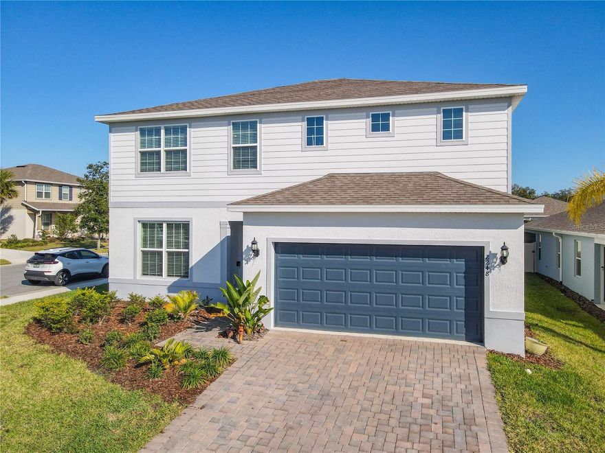 Welcome to 2248 Canopy Terrace—a place that instantly feels warm, inviting, and easy to call home. Built in 2024 and cared for with pride, this like-new DeLand corner-lot property offers the perfect balance of comfort, practicality, and modern living.

Inside, you’re greeted by bright, welcoming spaces enhanced with upgraded light fixtures, ceiling fans, and beautiful 42-inch upgraded cabinetry paired with quartz countertops throughout, giving the home a clean, polished, modern feel. The primary suite features a luxury walk-in shower, creating a calming retreat at the end of the day, while the downstairs bathroom offers convenient access for guests.

You’ll appreciate the oversized pantry and handy under-stair storage—ideal for staying organized and keeping daily life running smoothly. The garage is thoughtfully improved as well, complete with storage and an EV charger, adding convenience and future-ready appeal.

Step out onto the screened-in lanai, the perfect spot to enjoy morning coffee, unwind in the evenings, or simply take in the peaceful surroundings. The backyard landscaping adds charm and creates a welcoming outdoor space that’s easy to enjoy.

The community itself offers even more to love, including a resort-style pool, playground, and scenic walking trail ideal for peaceful strolls or active afternoons. HOA amenities include 1-gig fiber internet, Spectrum TV, access to the community pool, and a neighborhood park, giving you exceptional value and convenience. And with Florida’s stunning natural springs nearby, plus the charm of Downtown DeLand with its shops, restaurants, and year-round events, you're in the heart of everything that makes this area special.

Filled with thoughtful updates and a warm, welcoming atmosphere, this home is perfect for anyone seeking modern living in a friendly, vibrant community. It’s more than a place to live—it’s a place to truly feel at home.