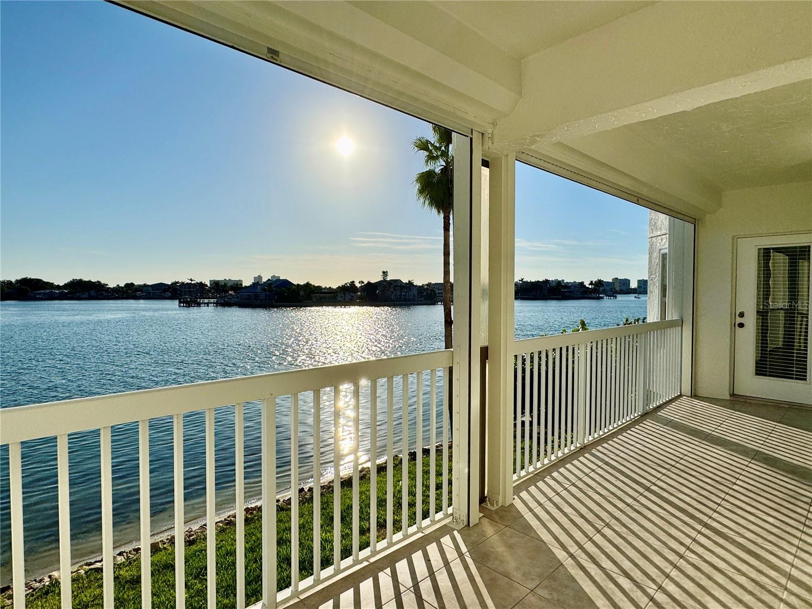 Waterfront condo with boat slip. Enjoy panoramic views of the Intracoastal Waterway from your oversize balcony at Captiva Cay Condominiums. Includes a 32’x15’ deeded boat slip with 12,000 lb lift in the sheltered private marina. This condo features 2 bedrooms, 2 baths, plus a den that could easily serve as a third bedroom. The primary suite has bay windows overlooking the water with a door to the balcony, and a walk-in closet. Captiva Cay amenities include a waterfront clubhouse, well-equipped gym, two heated pools (25-yard lap pool) spa, fishing dock, private beach ideal for kayaking and paddle boarding, and beautiful landscaping throughout. Nearby is Sunset Beach, restaurants, bars, parks, including a dog park, and tennis courts. Includes assigned parking under the building and storage unit. The first floor of this building is approx. 17' above sea level. The milestone inspection has been completed and the association is in compliance with the law’s requirements.