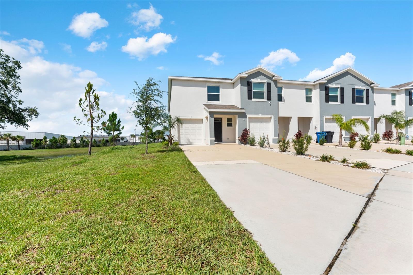 ***FURNISHED OR UNFURNISHED TOWNHOME! LOWER your mortgage balance & LOWER your interest rate with the "All-In-One Loan™" by CMG Home Loans - a mortgage product very competitive to builder financing that empowers you to pay off your mortgage balance FASTER! END UNIT. WATER VIEW IN BACK WITH NO REAR NEIGHBORS (PREMIUM LOT). Built in 2023 and carefully maintained, this is your turnkey option to move-in on closing day with your bedrooms, living room (smart TV & sectional couch included), and fully-stocked kitchen all ready to go. Seller is motivated to remove if needed, but what a thought to have everything ready for you at closing! The "Vale" floor plan is well laid out with ample cabinetry, storage, and 1-car garage with driveway suited for 4 more vehicles. Upstairs is the master suite that is separated by an open loft at the top of the stairs, and two guest bedrooms which are adjoined by a corner Jack & Jill bathroom. HOA fee includes the beautiful community pool, playground, common area maintenance, landscaping, and water. Across the street from the shoppes & grocery of Mangrove Bay Village & new retail/commercial being built next door. When visiting Mangrove Point, give this one a look!