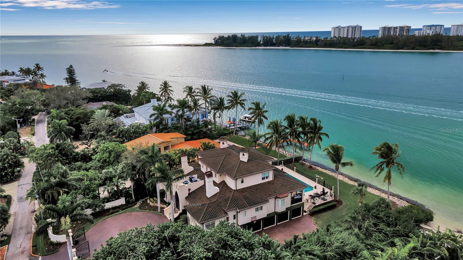 EXQUISITE HOME. "Every detail considered" WHERE SARASOTA BAY MEETS THE GULF OF MEXICO. NORTH SIESTA KEY. Do not miss this unparalleled opportunity to own an exquisite waterfront home, where luxury, location, and breathtaking views combine to create the ultimate island sanctuary. This timeless residence, nestled on Big Pass at the entrance to the Gulf of Mexico, promises an exceptional lifestyle. The main home was untouched by hurricane waters, with only minimal cleanup needed in the non-conforming space. After the recent hurricanes, no water intrusion has been noted, underscoring the home’s robust construction. The sellers have invested in a brand-new tile roof, ensuring long-term value and peace of mind—even though the existing roof had years of life left.
Elegantly appointed, this home offers an effortless transition for new owners, allowing immediate enjoyment. Located on the coveted north end of Siesta Key, the home provides unrivaled beach access and sweeping views of the Gulf of Mexico and Big Pass. Whether it's spectacular sunrises, sunsets, or the tranquility of island living, this residence is a true escape. Siesta Key has been recognized as the number one beach in the United States multiple times by Dr. Beach. The soft white sand is made almost exclusively of pure quartz, which remains cool on the feet even when baked in the Florida sun.
Step inside to experience the grandeur of this architectural masterpiece by a well-renowned architect. The open-concept living space flows seamlessly, with soaring ceilings and floor-to-ceiling impact windows framing panoramic, 180-degree views of the sparkling waters. A private elevator transports you between levels, adding both convenience and sophistication. The gourmet/chef's kitchen, equipped with high-end appliances (Wolf, Miele, etc.), sets the stage for both intimate meals and grand entertaining.
This home’s five spacious en-suite bedrooms, provide luxurious comfort and privacy. Designed for light and air, every room offers stunning vistas, creating an inviting and serene atmosphere. The property has undergone over $3 million in upgrades since 2020, ensuring that every detail is perfect. From Italian plaster and book-matched Calcutta Gold marble to custom wood floors and a bespoke Clive Christian kitchen, the Kohler natural gas generator supplies the entire home, three fireplaces, an elevator, a central vacuum, and 2 Tesla car chargers, no expense has been spared. Furnishing may be purchased separately.
Smart home features include Lutron lighting, an integrated security system, and commercial-grade Wi-Fi in every room, ensuring modern convenience at your fingertips. Additional amenities include a four-car garage, a 40x20 pool and spa, a custom walnut library, a cellular gate call box, Seura TV mirrors in the primary and in the second primary suite, with elevator access, and motorized window blinds complete this extraordinary residence.
This is a rare opportunity to own a once-in-a-lifetime waterfront home on Siesta Key. With its unparalleled location, stunning design, and luxury upgrades, this residence epitomizes elevated island living. Don’t miss the chance to call this exceptional residence HOME.