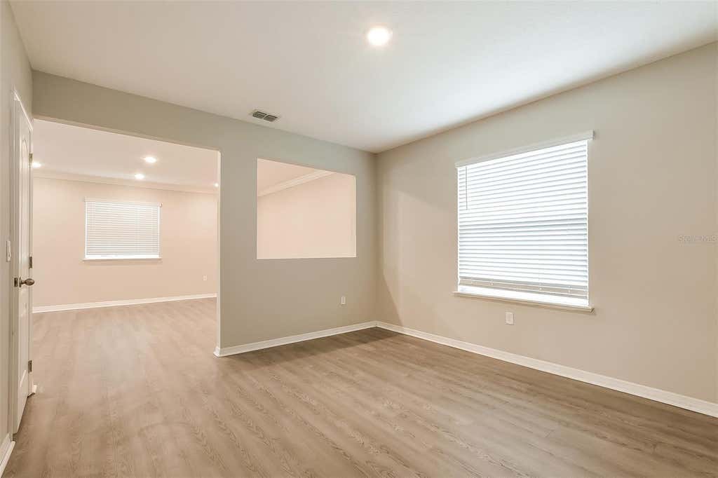 Photo of 1926 Bell Creek Loop, Fruitland Park, FL 34731 (MLS # O6428267)
