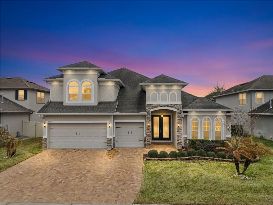 OVER $100,000 in upgrades! WHY WAIT to build?? This stunning home consists of five-bedrooms, four FULL bathrooms, THREE-car garage and is situated in one of Central Florida’s most desirable and rapidly expanding areas. This thoughtfully designed Dream Finders home boasts an exceptional floor plan featuring a FIRST FLOOR PRIMARY SUITE. There is also a private second master suite and a dedicated MEDIA ROOM upstairs. The media room is equipped with a projector screen, SURROUND SOUND, and a bar with a mini-fridge.The home welcomes you with glass inset double front doors, high tray ceilings, elegant light fixtures, and statement ceiling fans throughout. The living room features a custom-built stone-accent FIREPLACE with an electric fireplace and built-in shelving. The GOURMET kitchen is equipped with upgraded appliances, a NATURAL GAS cooktop, a DOUBLE OVEN, and a large island with ample seating—ideal for both everyday living and entertaining.Triple-stacking glass sliders open to a screened-in patio and fully FENCED backyard. There is a natural GAS connection on the lanai for your grill. The three-car garage offers ample storage and epoxy floors.Additional features include a whole house WATER SOFTENER system, MUDROOM located near the garage, under-stair storage, eight SECURITY CAMERAS with closed-circuit TV capability, a Ring doorbell, two Nest thermostats, and keyless entry.This beautifully upgraded home offers space, functionality, and modern convenience in a prime location. 

Ardmore Reserve offers resort-style amenities including a community pool, sun deck, veranda, and shaded playground—and no CDD fees. Conveniently located near the Florida Turnpike, the community provides easy access to Disney and area attractions (approx. 30 minutes), Orlando International Airport (approx. 40 minutes), downtown Clermont and Winter Garden, shopping, dining, golf courses, trails, the National Training Center, and major retailers such as Costco, Publix, Target, and Home Depot. The new AdventHealth Minneola Hospital, medical offices, VA facilities, and top-rated schools including Minneola Charter School are just minutes away. Schedule your private showing today!