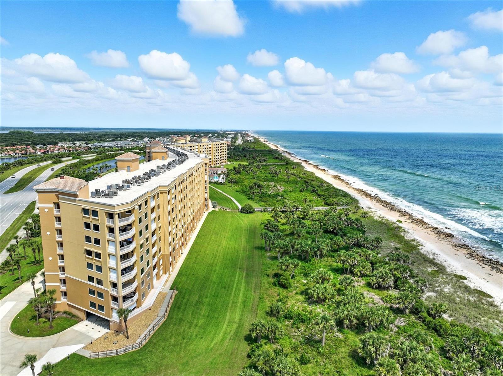 Imagine waking each morning to the gentle hush of waves and the golden glow of the sun cresting over the Atlantic Ocean; nature’s most luxurious alarm clock. Step onto your private balcony, coffee in hand, as the ocean stretches endlessly before you, inviting you to start the day in pure serenity. This stunning, 3rd floor, 3 bedroom, 2 and a half bathroom condo in the exclusive Surf Club III tower at Matanzas Shores offers 1,640 square feet of airy, open living that blends breezy coastal elegance with high-end finishes. Granite counters, stainless steel appliances, engineered hardwood floors, tray ceilings, crown molding throughout, and more. The oceanfront primary suite is your personal retreat, complete with a spacious, custom, walk-in closet, as well as an oversized, walk-in shower, and plenty of extra room so you can design your dream bedroom and flex space to highlight the multiple windows, superb natural light, and glorious views of heaven on earth. Two spacious guest bedrooms and bathrooms paired with a split floorplan are like comfy, cozy, private suites for your overnight guests or family too! In unit washer and dryer and newer AC are the icing on the cake!
Step outside and discover a community that feels like a private resort. Swim in one of the multiple sparkling pools, work out in the state-of-the-art fitness center, or challenge friends to tennis or pickleball. Relax in one of the libraries or clubhouse, or wander lush walking trails that weave through natural dunes, green space, and woods. Lounge on the sand by the ocean with private beach access, or explore the Intracoastal Waterway from the community dock. Perfect for fishing, kayaking, or simply watching the boats drift by. With 2 secure underground parking spaces, a storage unit in the garage for beach chairs and golf clubs galore, and 24/7 gated entry, your comfort, peace of mind, and convenience are always top priority.
Whether you’re seeking a full-time oceanfront haven, a luxurious vacation escape, or a smart investment in Palm Coast’s best-kept secret, this condo offers it ALL. Breathtaking views, thoughtful upgrades, and a community designed for endless relaxation and recreation. Your oceanfront dream begins here.
One or more photos are virtually staged.