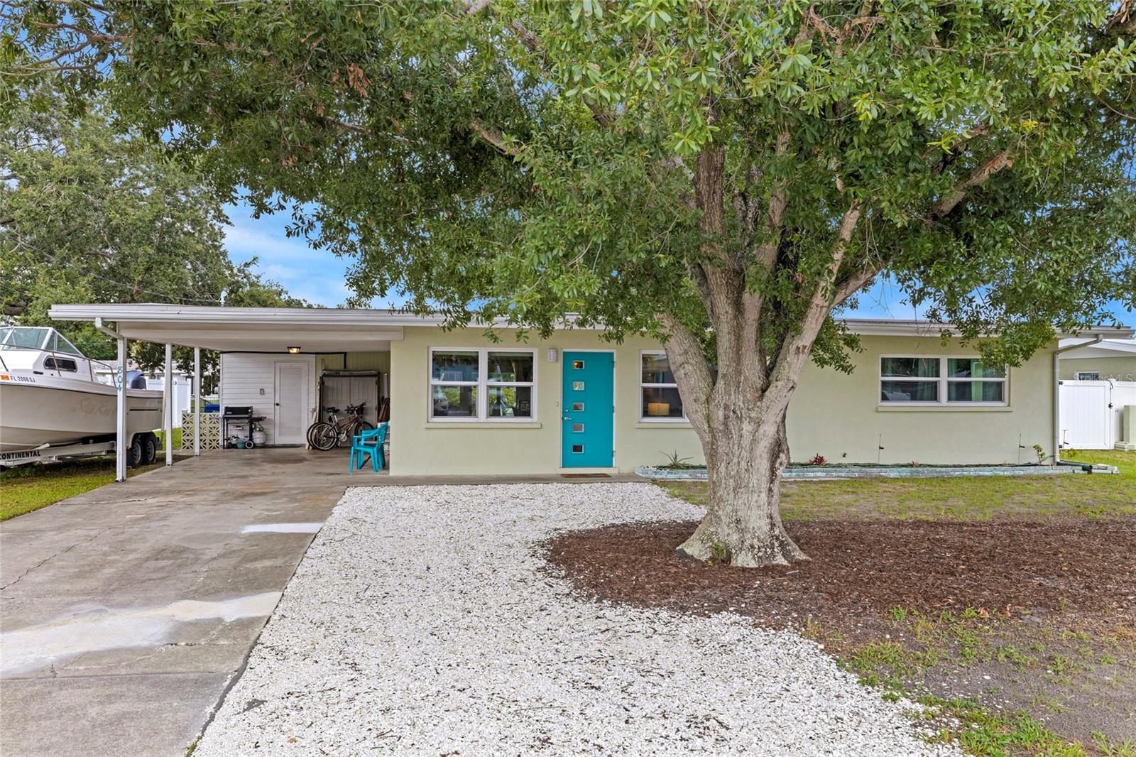 Discover the ultimate in Florida living! This exquisite home, perfectly situated on a picturesque canal lot near the Manatee River, offers effortless access to the Gulf for all your boating adventures. Step inside and be captivated by the breathtaking water views from the open-concept living area, enhanced by plenty of modern upgrades. The heart of the home—the fully remodeled kitchen—features an expansive island ideal for both cooking and entertaining, alongside custom cabinets and a pantry with convenient roll-out shelving. You'll also enjoy elegant granite countertops and a stunning oversized ceramic subway tile backsplash. Brand new stainless steel GE appliances, including a cutting-edge ceramic smooth top range with a convection oven, a microwave with ventilation, and a stylish cabinet-depth French door refrigerator, complete this gourmet setup. Venture down the cozy hallway to find two generously sized bedrooms and a beautifully updated bathroom showcasing double floating vanities with a sleek quartz makeup counter and a convenient tub/shower combo. The spacious Florida Room at the back of the house invites you to soak in spectacular views of your backyard and canal, creating an oasis of relaxation. Plus, the updated second shower bath and laundry/storage room is conveniently situated just off the Florida Room. Nestled in a serene community with no HOA fees, this gem is a stone's throw from shopping and major highways. Enjoy peace of mind with impact windows and sliding doors throughout, designed for safety and durability. A new roof installed in 2018, complete with hurricane tie-down strapping and deck nailing, ensures your home meets Florida wind codes. Plus, a new dock and lift added in 2019, along with a brand new seawall completed in July, adds significant value to this remarkable property. With zero flooding or wind damage from previous storms, this home promises not only beauty but also security. Embrace year-round stunning water views from your backyard and endless possibilities for entertaining family and friends. A comprehensive list of upgrades is available upon request, making this stunning home an opportunity that shouldn’t be missed! Is this your perfect match? Book your showing today!