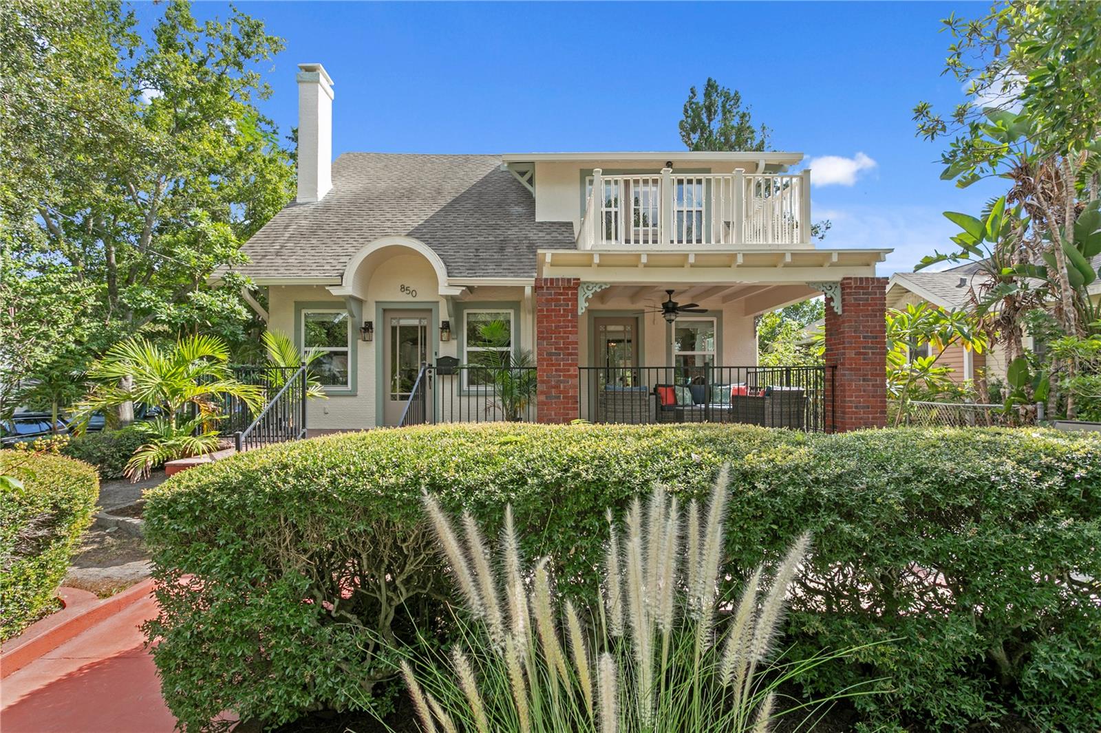 STUNNING 1925 CRAFTSMAN ESTATE WITH INCOME-PRODUCING GUEST HOUSE MINUTES FROM CRESCENT LAKE PARK IN ST PETERSBURG FL | Discover architectural magnificence in this meticulously preserved 1925 Craftsman masterpiece, nestled in one of St. Petersburg’s most coveted neighborhoods just a short 2 block stroll from the pristine beauty of Crescent Lake Park. This extraordinary estate seamlessly blends century-old craftsmanship with contemporary luxury across 2,754 square feet of elegant living space, a 2 car detached garage, complemented by a fully independent and renovated 910-square-foot guest house complete with separate address, 2 bedrooms and an office, utilities, its own laundry, and a garage for storage.
Every corner of this distinguished home celebrates its rich heritage through carefully preserved original features: hardwood floors, hand-crafted artistic wall plaster, elegant crown molding, a striking wood burning fireplace, period-authentic interior doors adorned with cut-glass knobs, and exquisite detailed trim work that speaks to the era’s superior artisanship. The options for the residence are endless. The main house offers 2 master suites with ensuite bathrooms (one downstairs and one upstairs) as well as a 3rd bedroom upstairs with a full guest bath. The downstairs primary suite offers zen-like qualities with a sizable bathroom complete with a wet shower and freestanding tub, dual vanities, and a commode room for privacy. The upstairs primary is incredibly roomy with a seating area for reading, dual closets and a private balcony retreat.
Modern updates have enhanced this classic beauty with today’s conveniences while respecting its historic integrity. Updates include a new flat roof (2024), three energy-efficient HVAC systems (2 of the 3 were replaced in 2024) with dual-zone climate control, vinyl double-pane insulated windows, premium appliances, and beautifully appointed renovated bathrooms. Enjoy the outdoors in rain or shine with a beautiful covered front porch, private fenced rear patio, and open patio adjacent to the covered patio in the front. The entertainment factor is off the charts with this home given all the spaces plus there is also room for a pool as well.
Positioned on a desirable corner lot for enhanced privacy, this property offers immediate access to Crescent Lake Park’s 56 acres of recreational paradise. Enjoy the one-mile paved walking trail, tennis and pickleball courts, dog park, playground, and the historic baseball field that once hosted Yankees, Mets, and Orioles spring training. Downtown St. Petersburg’s vibrant dining, arts, and entertainment scene awaits just minutes away as is 4th Street and 9th Street for lots of dining and coffee shop options. This is more than a home—it’s a rare opportunity to own a piece of St. Petersburg history while enjoying modern luxury and investment potential in an unmatched location.