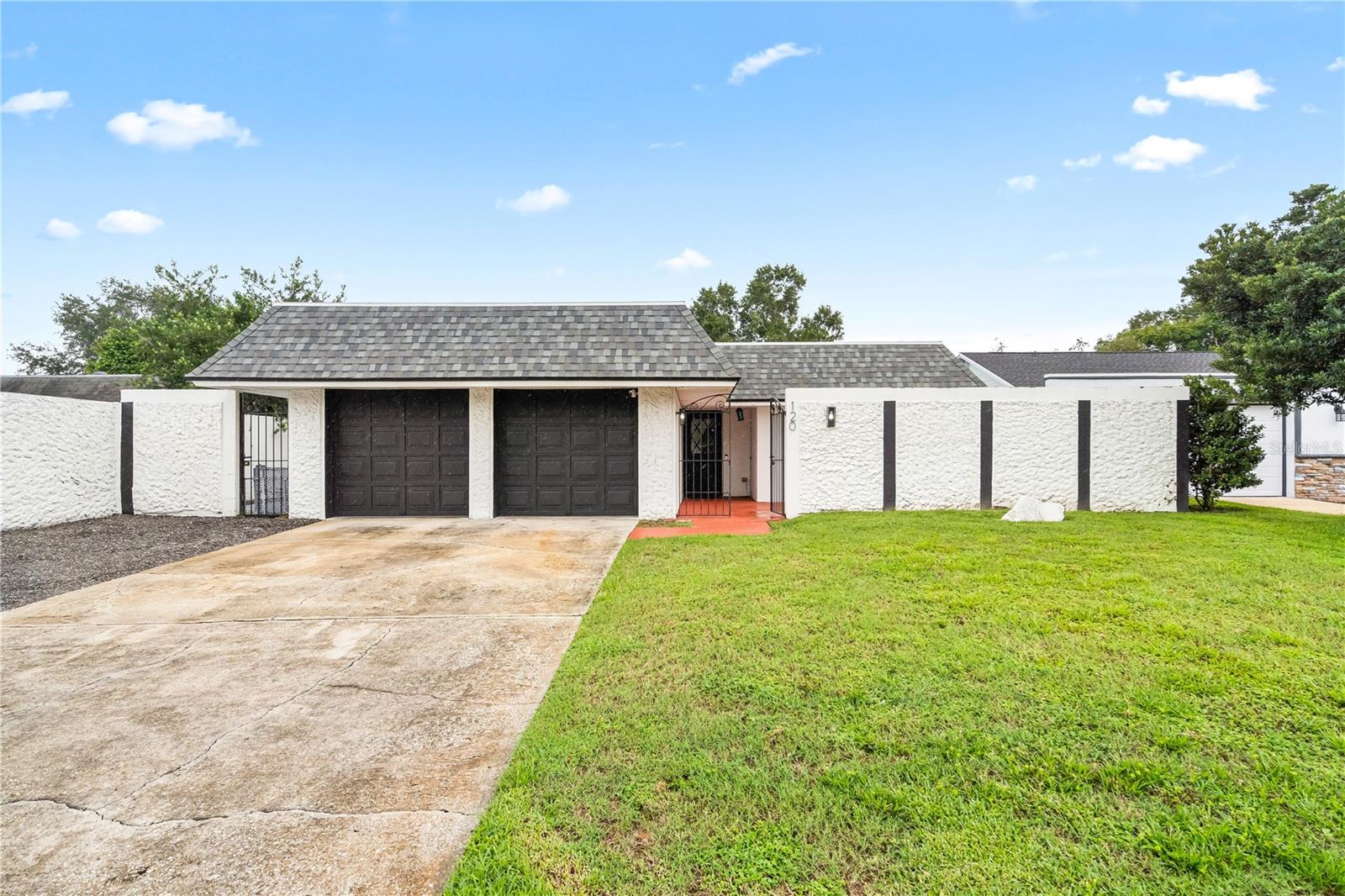 Welcome to this FULLY RENOVATED 3 bedroom, 2 bathroom single story home! Recent updates include a NEW ROOF (2023), electric panel (2020), HVAC (2019) with a smart thermostat, bathroom plumbing (2023) and new flooring (2024) throughout the home. Inside, the open concept floor plan features a bright kitchen with QUARTZ COUNTERTOPS and new appliances. The two full bathrooms have been fully remodeled with modern fixtures. The primary suite offers a walk in closet, while the two additional bedrooms include built-in storage. The 2 car garage with a newly expanded driveway offers plenty of space for extra vehicles, guests or even an RV. Enjoy the beautiful Florida weather in your private backyard with multiple patios. Located in a quiet neighborhood with a LOW HOA which includes a pool, clubhouse, tennis courts and a playground! This move in ready home blends modern updates, timeless comfort and community amenities all in one!