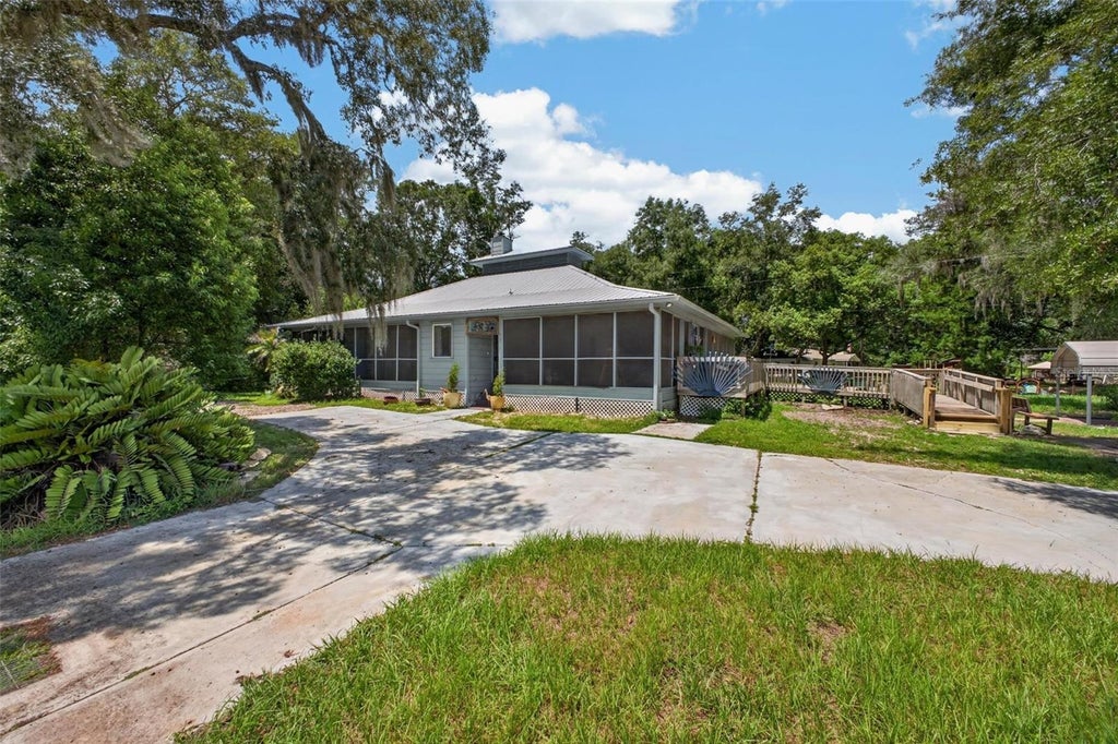 Photo of 25717 Troon Avenue, Sorrento, FL 32776 (MLS # O6437797)