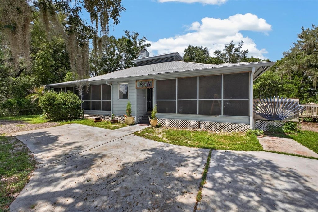Photo of 25717 Troon Avenue, Sorrento, FL 32776 (MLS # O6437797)