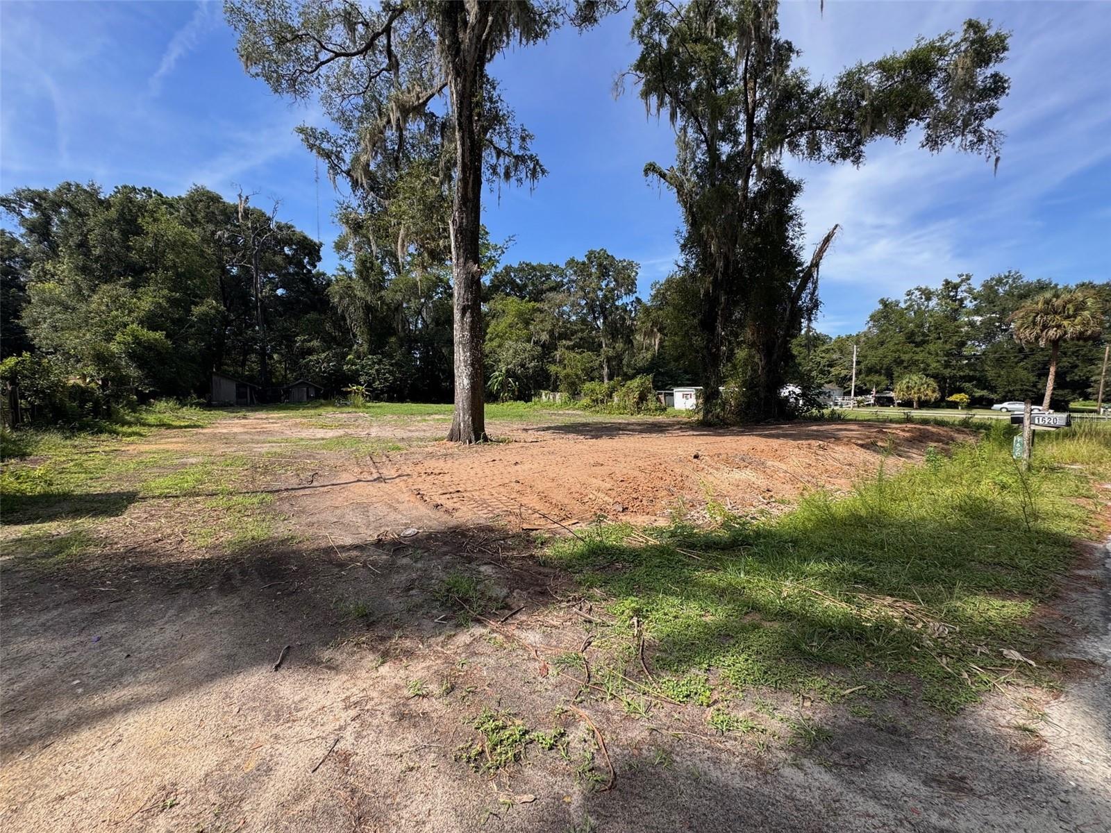 This cleared and build-ready .48-acre lot offers a fantastic opportunity to build your dream home or bring in a mobile home in a convenient location just minutes from the heart of Ocala. Zoned residential and located off a paved road, this property previously had a mobile home on site and a well is in place—offering an excellent head start for your future build. The well has not been used by the current owner and is being sold as-is with no warranty.
The lot is mostly open and ready for construction, gardening, or additional use. With no current structure on the site, you have the freedom to design and build to suit your needs. Additionally, this parcel has been grandfathered in to allow for a new mobile home, though buyers are encouraged to verify zoning and usage directly with the county to ensure it aligns with their plans before making an offer.
Conveniently located in a quiet residential area, this property is less than 5 minutes to grocery stores, restaurants, and local conveniences, and just under 10 minutes to Downtown Ocala, making it ideal for those who want rural space without sacrificing access to town. It’s also less than 4 miles to I-75 and the hospital, offering excellent access for commuters or those needing close proximity to medical services.
Whether you're ready to build or bring in a new home, this is a great opportunity to invest in a centrally located lot with utilities already nearby. Enjoy the best of Ocala living with space, flexibility, and unbeatable access to everything you need.