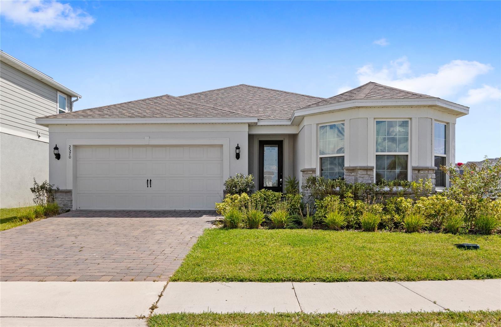 One-of-a-kind home, located in the rapidly developing Tohoqua community in Saint Cloud! Built by Pulte Homes in 2023, this Palmary model is loaded with upgrades and is turn-key, ready for its new owners. This popular floor plan is no longer available to build new, making this a rare find. Located just 10 minutes to the highly anticipated NeoCity development, 25 minutes to Orlando International Airport, 30 minutes to Universal Studios, and 25-30 minutes to Walt Disney World, this home keeps you close to all of the action that Central Florida has to offer! The spacious 3 bedroom, 2 bathroom open-concept floor plan provides ample space, privacy, and comfort for residents and guests alike. Inside, you'll find upgrades including custom built-in shelving, upgraded fixtures, ceiling fans, and a "secret" lounge disguised behind two bookshelves - any homeowner's dream! An extended lanai makes indoor-outdoor living a breeze, extending your overall living space. Sitting on an oversized corner lot, enjoy your large fenced-in yard, offering room to run for family, friends, and pets, or a potential space for your future pool, suitable for all of your outdoor entertaining needs. Your 2-car garage and brick-paver driveway make parking seamless and hassle-free. A brief walk, or a 3 minute drive, gives you easy access to Tohoqua's clubhouse, equipped with world-class amenities including a resort style pool, fitness center, tennis/pickleball courts, a playground, and miles of walking trails. This is a home you don't want to miss in an area that's going to offer exciting new developments for years to come. Contact us to schedule your private viewing today!