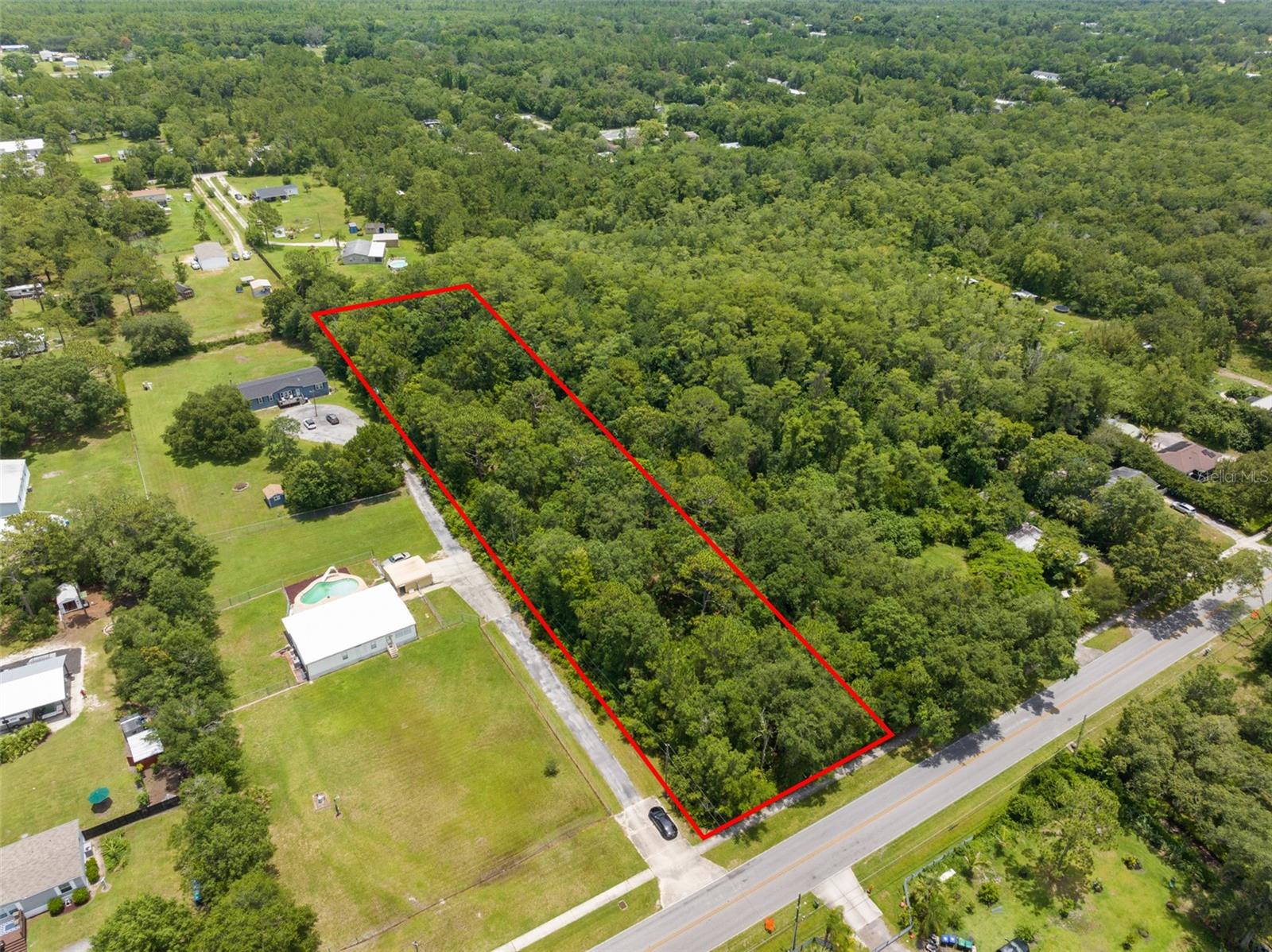 **This property qualifies for a closing cost credit up to $2,600 through the Seller’s preferred lender.** Build Your Dream or Invest for the Future – 2039 N 6th St, Orlando, FL 32820. Here’s your chance to own a versatile piece of land in one of East Orlando’s growing communities! This spacious vacant lot is zoned R-T-2, allowing for residential use including manufactured or modular homes, duplexes, or single-family homes—offering flexibility whether you're building for yourself or as an investment. Nestled in a quiet, residential area with a country-like feel, this property delivers peaceful surroundings while being conveniently close to everything. With no HOA, you're free to bring your RV, boat, or work vehicles—no restrictions, no compromises. Located just minutes from UCF, Waterford Lakes, Downtown Orlando, and major highways, you’ll enjoy easy access to shopping, dining, entertainment, and top-rated schools, all while still having room to breathe. Whether you're ready to break ground on your forever home, create a rental opportunity, or hold for future development, 2039 N 6th St offers incredible potential and flexibility in a growing area.