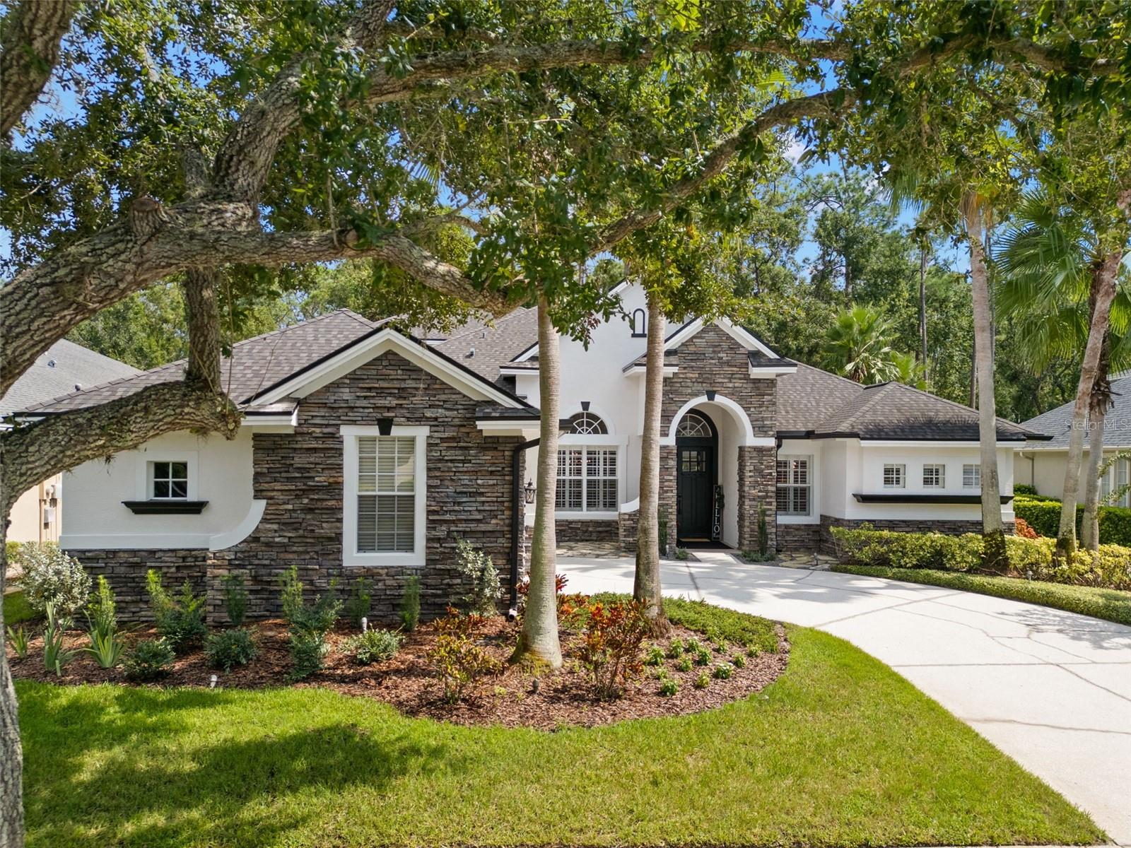 STUNNING HOME located in the coveted GATED COMMUNITY OF WATERCHASE showcasing one of the community’s most highly sought after floor plans, designed for everyday family living and unforgettable entertaining! Step inside to a seamless blend of REFRESHED CONTEMPORARY DESIGN, custom architectural details, 12 FT soaring ceilings, sun drenched open concept living spaces with oversized windows dressed in shutters, a home that perfectly balances comfort and sophistication, all enhanced with NEW FLOORING THROUGHOUT.
The heart of the home—a NEW REIMAGINED CHEF-INSPIRED KITCHEN, boasting endless cabinetry enhanced with stunning quartz, LED lighting, bar/serving center with wine fridge, natural gas cooktop, expansive island with ample seating overlooking the open concept living space that blends into the expansive outdoor entertaining area featuring a GAS FIREPLACE surrounded by a custom stone media wall, enhanced with beautiful wood plank ceilings, and a backdrop of the free form designed pool/spa with cascading spillover creating a soothing soundtrack of flowing water and a serene ambiance with a tree canopy of the preserve just beyond, WOW!
All bedrooms are strategically placed for functionality and privacy, the primary bedroom encompasses one side of the home with dual closets, large bath and access to the outdoor area, Also on the MAIN LEVEL, 2 additional bedrooms that enjoy a flex space separation for a kids play area or whatever your needs might be, in the rear of the home you will find the private guest suite with walk in closet and a new bath, upstairs a large bonus, another bedroom with built in Murphy bed, desk and a full bath, Completing this property is the private dedicated den/office located in the front of the home…ADDITIONAL NOTABLE IMPROVEMENTS; NEW FULL INTERIOR PAINT, CUSTOM INTERIOR TRIM DETAIL, NEW ROOF (2021), NEW DR HARDWARE throughout home, REFRESHED LANDSCAPE, LANAI CEILING ENHANCEMENT, BATH RENOVATIONS, NEW FANS AND LED LIGHTING, NEWER AC’S, AND SO MUCH MORE, THIS IS A TURN KEY HOME! WATERCHASE COMMUNITY is recognized for its incredible balance of nature preservation and planned residential living, residents enjoy 2 pools, a 2 story waterslide, tennis, basketball, NEW pickleball courts, fitness center, turf tot playground and a full time activity director at the helm of so many year round activities, Come home to the WATERCHASE LIFESTYLE, vacation living year round! The location of Waterchase is positioned in the North Tampa-WESTCHASE AREA, an area known for suburbia lifestyle, TOP RATED SCHOOLS and a centralized location for Greater Tampa Bay with an easy commute to DOWNTOWN TAMPA, TIA, the gulf beaches, Clearwater and all the places you wish to be! WELCOME HOME!