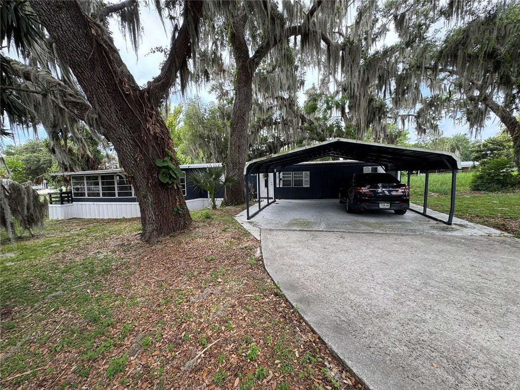 Photo of 17336 Palm Drive, Montverde, FL 34756 (MLS # O6414848)