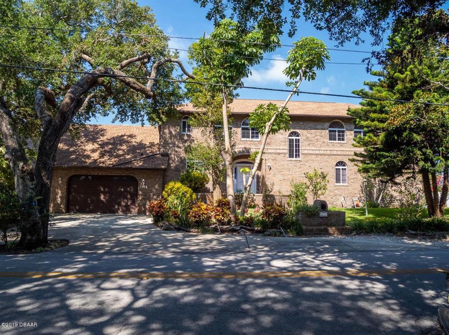 What marks these words for the discerning luxury buyer? Perhaps it is the EXTRAORDINARY expansive intra-coastal views or the vistas that extend all the way out to the Tomoka River Basin. Or the peace and tranquility of wind swept oaks that provide shade and energy efficiency while allowing tropical foliage below to flourish. Maybe it's the timeless low maintenance brick exterior perched high on the river bank with its grand footprint and 126 feet of river frontage on PRESTIGIOUS John Anderson Drive. It could be interior features such as ELEGANT gleaming "real" hard wood floors that capture the reflection of the river while you're entertaining friends and family. With nearly 4000 sq. ft. of living area to accommodate a growing family, a multi-generational situation or anyone who needs the space- it's certainly UNIQUE! 

But there's so much more! A custom brick archway surrounds the range in the kitchen providing an Old World or Mediterranean flair. There's a loft with half bath perfect for a playroom, study or home office. The owner's retreat is conveniently on the first floor with access and views of the water. Formal dining riverside that leads to a 60 ft rear screened deck overlooking the intra-coastal waterway. Another unique feature includes a huge Florida basement that would be perfect for a wood shop, indoor nursery, motorcycles or any kind of hobby/home business that needs lots of space. There's an overhead door to access the basement area to move large items in and out. In 2006 the current owners invested over $100K for a brand new seawall. Pilings are in place to rebuild a sizable dock. This home is unmatched in quality of construction. Offered at an incredible value for direct intra-coastal living. New roof, water heater, HVAC, carpet and paint in 2017. ;Water: City