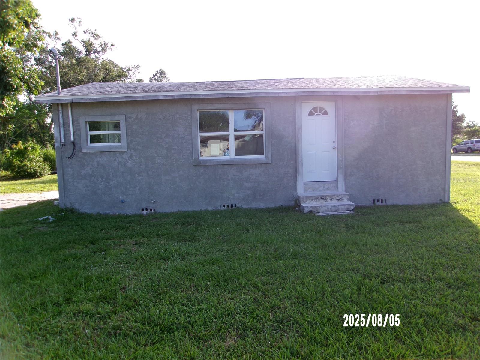 This quaint cottage is just minutes from downtown Punta Gorda with restaurants, shopping, parks and boating. It features 2 bedrooms/1 bath and sits on a corner lot. Although many improvements have been made - new windows, door, A/C, roof and appliances - it still needs flooring, kitchen cabinets and drywall. Finish the work and enjoy this great area or use it as a rental property.