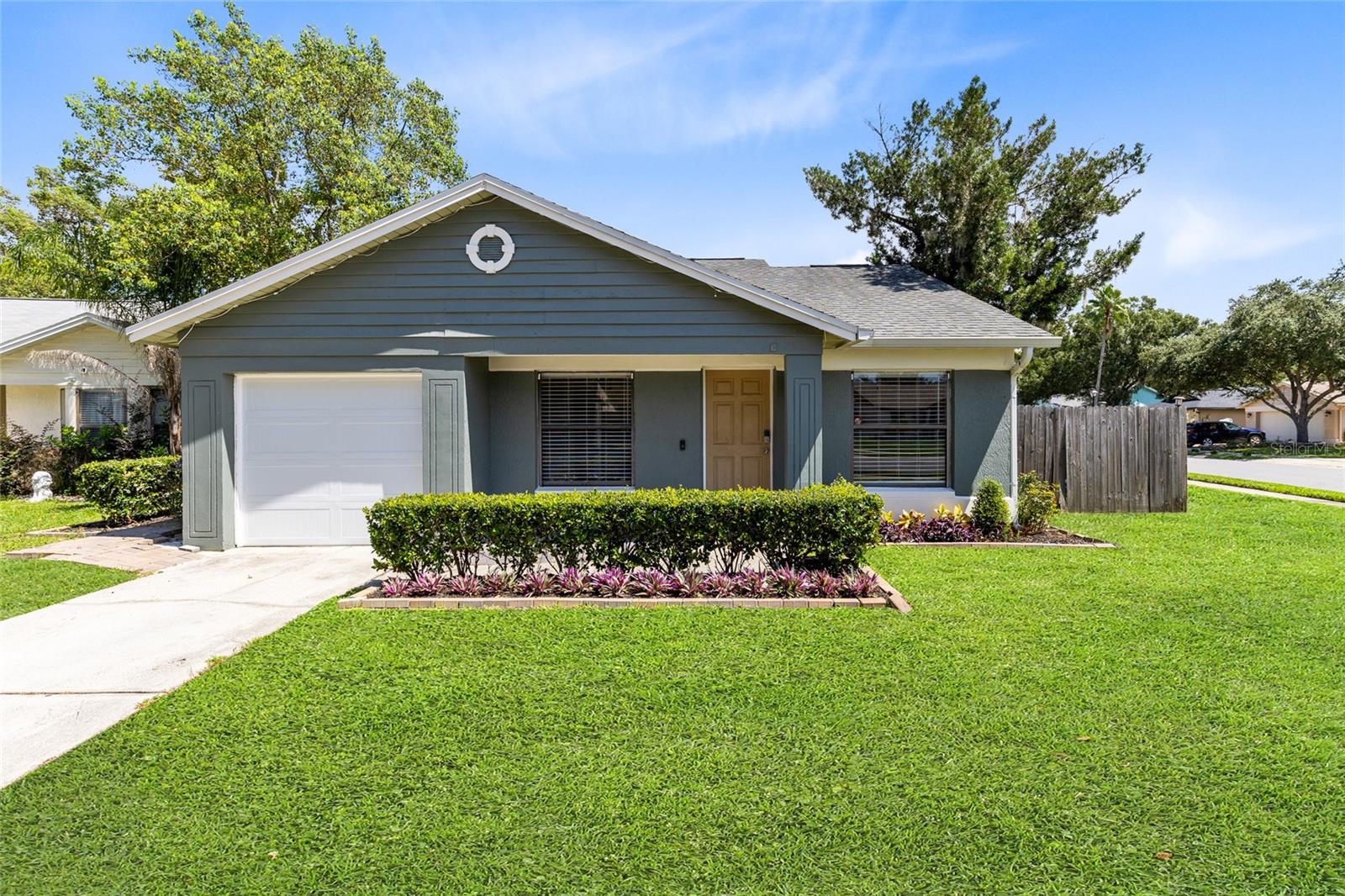 One or more photo(s) has been virtually staged. See virtual tour link for 3D Home Tour. Welcome to this beautifully renovated 3-bedroom, 2-bathroom home perfectly situated on an rare Oversized Corner Lot in the sought-after community of Alafaya Woods. This home offers a rate buy down using preferred lender. From the moment you step inside, you’ll notice the attention to detail with Brand New Luxury Vinyl Flooring(2025) throughout, modern Ceiling Fans in every room, upgraded Kitchen Lighting, Quartz Countertops(2025) with a designer Tile Backsplash(2025). Roof (2018) AC unit (2020). Completely Renovated Master and Guest Bathrooms, offering a fresh and contemporary feel. The Exterior has also been fully updated with new paint and attractive front-yard landscaping, while the spacious backyard is Fully Fenced, providing the perfect setting for family gatherings, outdoor living, and entertaining. Just a short walk to the local elementary school, this home is nestled in one of Oviedo’s most family-friendly neighborhoods. Consistently ranked as one of the best places to live in Central Florida, Oviedo is known for its A-rated schools, proximity to major highways for easy commuting, nearby hospitals, and access to an abundance of shopping, dining, parks, and trails. This home combines modern upgrades, a desirable location, and a community lifestyle that makes it the perfect choice for today’s buyer.