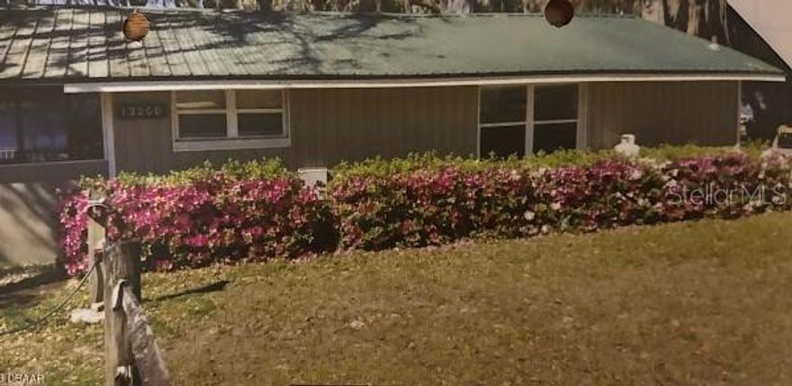 THE CAPTAIN'S COTTAGE - Located in the Cottages of Salt Spring Resort - A waterfront cottage on a 1/4+ acre site. Unique within the park and around the Lake! Picture this: Your own little classic waterfront cottage, with no immediate abutters, perfectly sited at the east end of Little Lake Kerr in the Salt Springs Resort in Salt Springs, FL. Your cottage - The Captains Cottage - is block built, sheathed with vinyl, with metal roof. The lot is lovingly richly landscaped and bounded by a traditional split rail fence. Your driveway is large enough to accommodate multiple vehicles. The 12x30 foot vinyl deck, the 16x20 aluminum framed screen room will keep you connected to the great outdoors. Shade is provided by the large oaks and the hickory trees gaily adorned with Spanish Moss that dances in the breeze. Sand hill cranes wander about. This cottage has the best view of the resort for those breath taking sunsets!