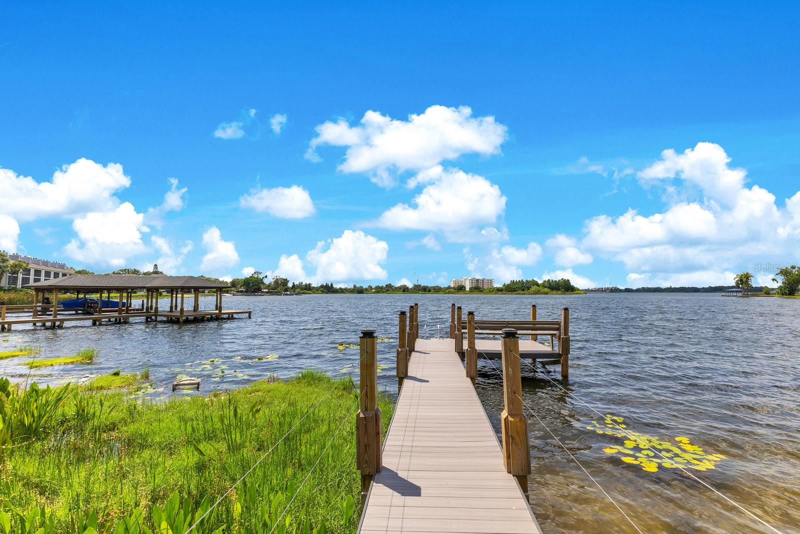 Complete Renovation 2023. Stunning lakefront home located on an expansive 1.52-acre buildable lot in highly desirable College Park, offering nearly 100 FEET of private shoreline along beautiful Lake Fairview. This rare ONE-STORY (all one level) custom designed residence has been completely reimagined down to the studs, featuring a split-bedroom layout with 4 spacious bedrooms and 4 full bathrooms, 3 separate wings. The home showcases porcelain tile throughout, a stunning floor-to-ceiling gas fireplace, a separate glass-enclosed office, and a show-stopping chef’s kitchen with granite countertops, a large center island, butler’s pantry, two refrigerators, two freezers, two wine coolers, and a dramatic floor-to-ceiling glass wine display. Enjoy breathtaking lake views and vibrant sunsets from nearly every room. The 2023 upgrades include a new roof, two new AC units, new windows and doors, SMART blinds and ceiling fans, two new water heaters, a new irrigation system with lake pump, a whole-house generator, a water softener, and a reverse osmosis system for drinking water. Have a dog? Enjoy the newly designed dog bath! Step outside to a newly paved lakeside patio perfect for entertaining, or launch a boat from your private ramp and dock. Lake Fairview is 48 feet deep and 405 acres -- ideal for boating, skiing, and water sports. New composite deck and open dock ($35k). With no HOA and ample space to expand, the property includes plans for a detached in-law suite with attached breezeway and offers the opportunity to build a pool or custom boathouse. A spacious three-car oversized garage, three Tesla chargers and newly paved motor court complete the property. Surrounded by $3M+ custom homes and just minutes from downtown Orlando and Winter Park, this location blends lakefront serenity with unmatched convenience near Edgewater Drive’s shops and restaurants. This is a truly exceptional opportunity to enjoy the ultimate Florida lakefront lifestyle.