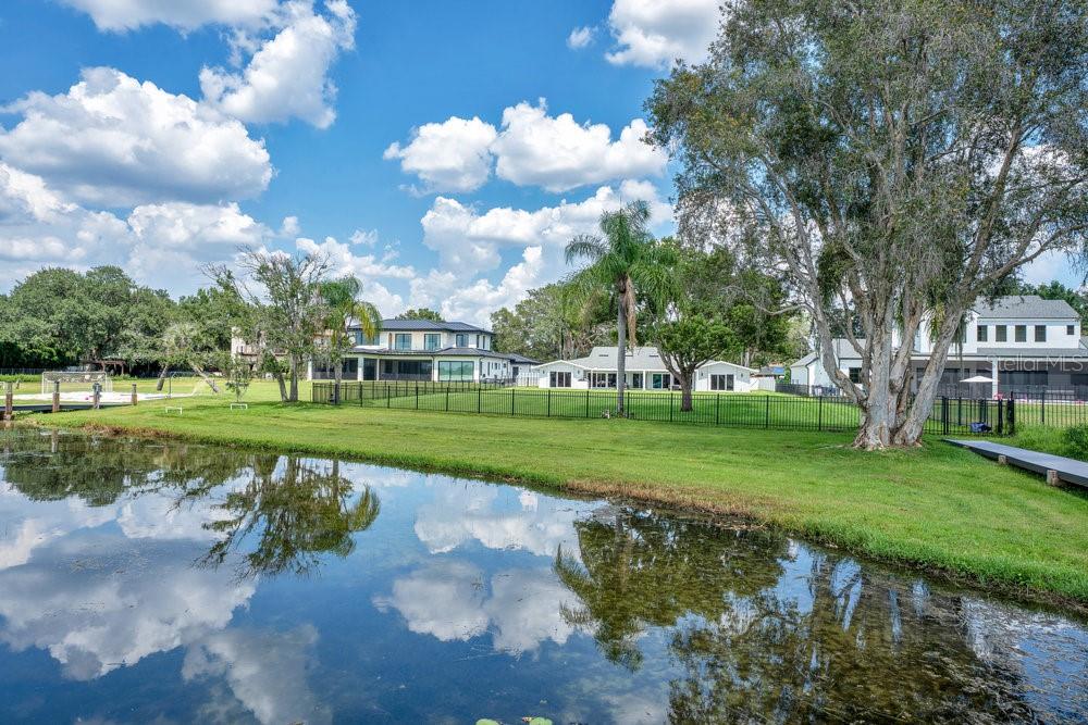 Huge Price Improvement! $492 a square foot for direct lakefront. Complete Renovation in 2023! Stunning lakefront home located on an expansive 1.52-acre lot in highly desirable College Park, offering nearly 100 FEET of private shoreline along beautiful Lake Fairview. This rare ONE-STORY (all one level) custom designed residence has been completely reimagined down to the studs, featuring a split-bedroom layout with 4 spacious bedrooms and 4 full bathrooms, 3 separate wings. The home showcases porcelain tile throughout, a stunning floor-to-ceiling gas fireplace, a separate glass-enclosed office, and a show-stopping chef’s kitchen with granite countertops, a large center island, butler’s pantry, two refrigerators, two freezers, two wine coolers, and a dramatic floor-to-ceiling glass wine display. Enjoy breathtaking lake views and vibrant sunsets from nearly every room. The 2023 upgrades include a new roof, two new AC units, new windows and doors, SMART blinds and ceiling fans, two new water heaters, a new irrigation system with lake pump, a whole-house generator, a water softener, and a reverse osmosis system for drinking water. Have a dog? Enjoy the newly designed dog bath! Step outside to a newly paved lakeside patio perfect for entertaining, or launch a boat from your private ramp and dock. Lake Fairview is 48 feet deep and 405 acres -- ideal for boating, skiing, and water sports. New composite deck and open dock ($35k). With no HOA and ample space to expand, the property includes rough plans for a detached in-law suite with attached breezeway and offers the opportunity to build a pool or custom boathouse. A spacious three-car oversized garage, three Tesla chargers and newly paved motor court complete the property. Surrounded by $3M+ custom homes and just minutes from downtown Orlando and Winter Park, this location blends lakefront serenity with unmatched convenience near Edgewater Drive’s shops and restaurants. This is a truly exceptional opportunity to enjoy the ultimate Florida lakefront lifestyle.