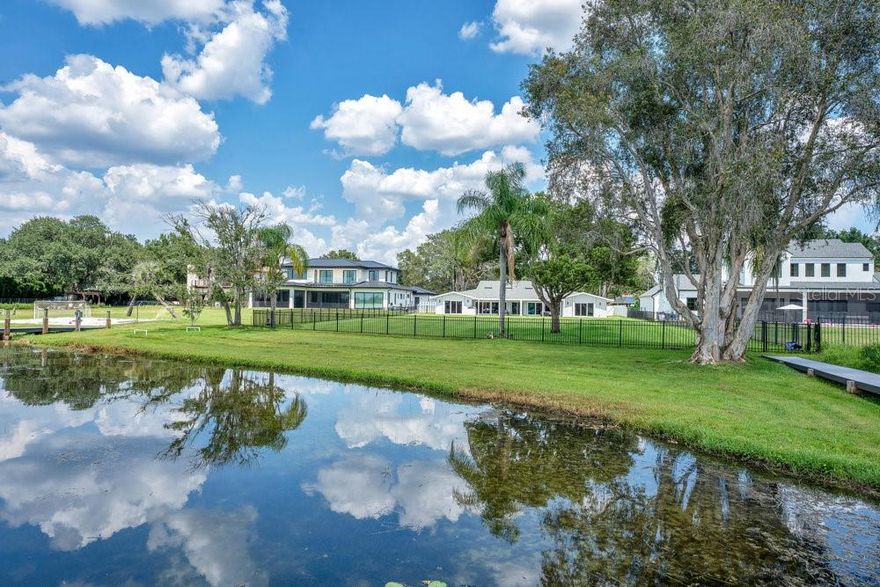 Huge Price Improvement! $492 a square foot for direct lakefront. Complete Renovation in 2023! Stunning lakefront home located on an expansive 1.52-acre lot in highly desirable College Park, offering nearly 100 FEET of private shoreline along beautiful Lake Fairview. This rare ONE-STORY (all one level) custom designed residence has been completely reimagined down to the studs, featuring a split-bedroom layout with 4 spacious bedrooms and 4 full bathrooms, 3 separate wings. The home showcases porcelain tile throughout, a stunning floor-to-ceiling gas fireplace, a separate glass-enclosed office, and a show-stopping chef’s kitchen with granite countertops, a large center island, butler’s pantry, two refrigerators, two freezers, two wine coolers, and a dramatic floor-to-ceiling glass wine display. Enjoy breathtaking lake views and vibrant sunsets from nearly every room. The 2023 upgrades include a new roof, two new AC units, new windows and doors, SMART blinds and ceiling fans, two new water heaters, a new irrigation system with lake pump, a whole-house generator, a water softener, and a reverse osmosis system for drinking water. Have a dog? Enjoy the newly designed dog bath! Step outside to a newly paved lakeside patio perfect for entertaining, or launch a boat from your private ramp and dock. Lake Fairview is 48 feet deep and 405 acres -- ideal for boating, skiing, and water sports. New composite deck and open dock ($35k). With no HOA and ample space to expand, the property includes rough plans for a detached in-law suite with attached breezeway and offers the opportunity to build a pool or custom boathouse. A spacious three-car oversized garage, three Tesla chargers and newly paved motor court complete the property. Surrounded by $3M+ custom homes and just minutes from downtown Orlando and Winter Park, this location blends lakefront serenity with unmatched convenience near Edgewater Drive’s shops and restaurants. This is a truly exceptional opportunity to enjoy the ultimate Florida lakefront lifestyle.