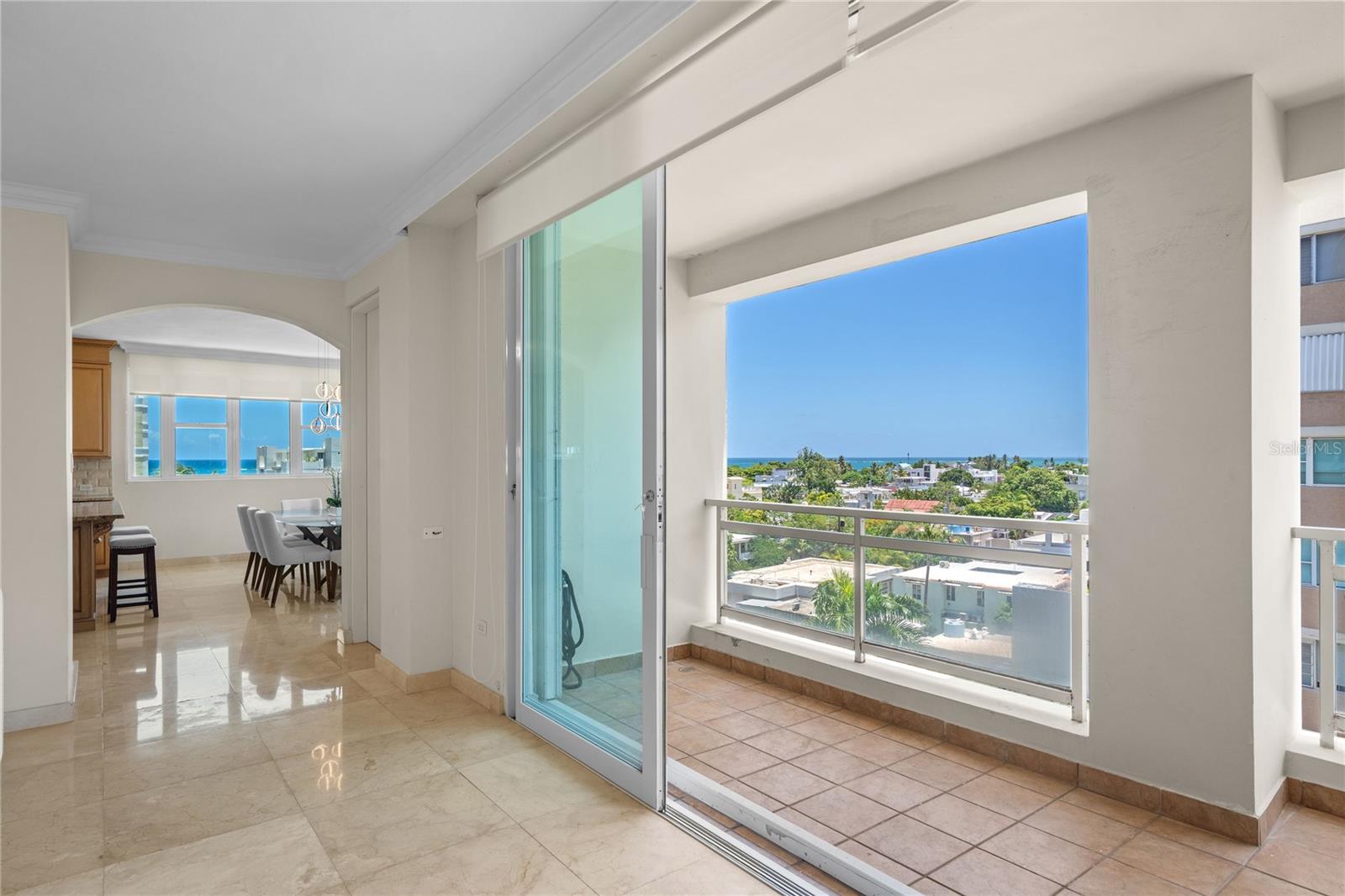Bright & Spacious Apartment – Carrion Court Plaza, Condado. Live just steps from the beach in this beautifully 3 bedroom, 2.5 bathroom apartment with 2,611 sq. ft. of living space and three covered parking, ideally located in the heart of Condado.
The residence features super bright windows that fill the living spaces with natural light, a private balcony perfect for enjoying the fresh air, and a partial ocean view that enhances the coastal lifestyle. The master suite offers a walk-in closet and in-suite bathroom, while the modern kitchen with island and spacious living and dining areas make it ideal for both comfort and entertaining.
Perfectly situated, Carrion Court Plaza is only 10 minutes from the San Juan airport and walking distance to Saint John’s School and Robinson School. You’ll also find Ashford Presbyterian Hospital, gourmet restaurants, hotels, supermarkets, and more just minutes away.
The apartment is fully furnished and available for immediate delivery. For outdoor enthusiasts, the popular Ocean Park Beach is only steps away, offering beach tennis, volleyball, cross training, kite surfing, and more.
The building provides 24/7 security, a full power generator, water cistern, gym, and direct access to the beach, ensuring both comfort and peace of mind.