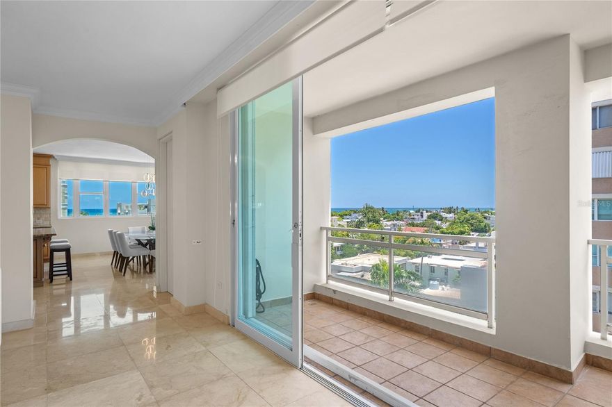 Bright & Spacious Apartment – Carrion Court Plaza, Condado. Live just steps from the beach in this beautifully 3 bedroom, 2.5 bathroom apartment with 2,611 sq. ft. of living space and three covered parking, ideally located in the heart of Condado.
The residence features super bright windows that fill the living spaces with natural light, a private balcony perfect for enjoying the fresh air, and a partial ocean view that enhances the coastal lifestyle. The master suite offers a walk-in closet and in-suite bathroom, while the modern kitchen with island and spacious living and dining areas make it ideal for both comfort and entertaining.
Perfectly situated, Carrion Court Plaza is only 10 minutes from the San Juan airport and walking distance to Saint John’s School and Robinson School. You’ll also find Ashford Presbyterian Hospital, gourmet restaurants, hotels, supermarkets, and more just minutes away.
The apartment is fully furnished and available for immediate delivery. For outdoor enthusiasts, the popular Ocean Park Beach is only steps away, offering beach tennis, volleyball, cross training, kite surfing, and more.
The building provides 24/7 security, a full power generator, water cistern, gym, and direct access to the beach, ensuring both comfort and peace of mind.