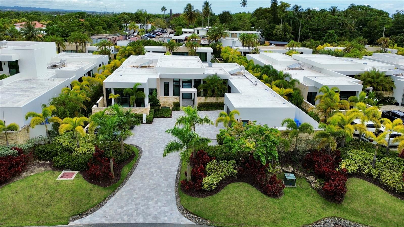 A one-of-a-kind gem in the market, 202 Legacy sets the standard for modern luxury and offers an unmatched level of refinement and style.
Located in the prestigious Dorado Beach East community, this exceptional estate features 8,881 sq. ft. of total construction, including 8,538.34 sq. ft. of interior space and a 342.66 sq. ft. terrace. Behind the main home, a detached casita offers 1,467 sq. ft. of air-conditioned space and a 290 sq. ft. covered, non-conditioned area.
This stunning property sits on a massive 2,398.49 sq. m. lot, providing the ultimate in privacy, comfort, and space. The main residence showcases the highest peak of luxury, boasting top-of-the-line modern features and finishes throughout.
With its clean, contemporary design and practically new condition, this home offers the perfect blend of sophisticated living and everyday convenience. The expansive layout includes a state-of-the-art kitchen, spacious living and dining areas, and multiple outdoor living spaces that seamlessly flow into each other, perfect for entertaining.
The focal point of the property is the magnificent elongated heated pool, with the detached casita situated to face its beauty. The casita itself is a serene retreat, featuring a private bedroom and full bath, as well as a cozy living room, full kitchen, complete gym, and a pool bathroom with an outdoor shower.
Enjoy exclusive community access to Dorado Beach East's world-class amenities, including golf courses, beaches, and fine dining. This is truly a home that redefines luxury living.
Don't miss your chance to own one of the most sought-after properties in Dorado. Schedule your private showing today and experience the elegance and grandeur of 202 Legacy.