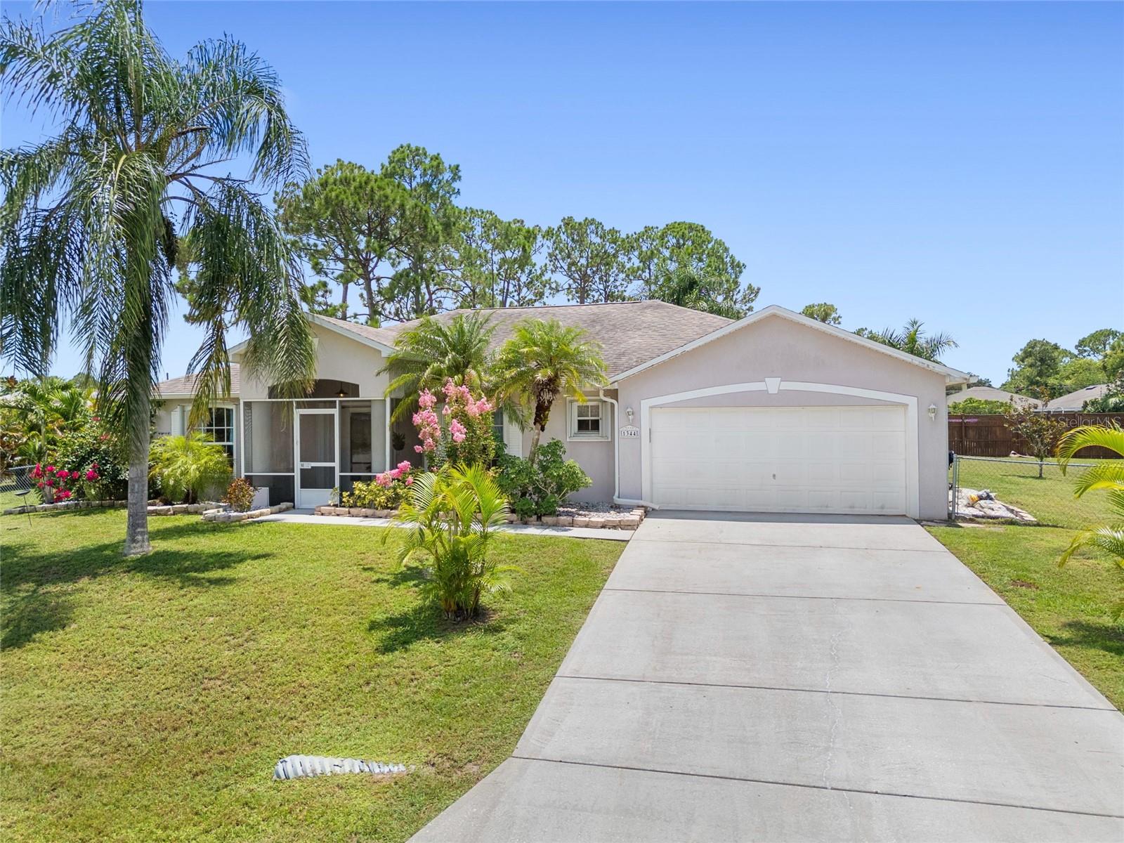 Located in a rapidly growing city just minutes from shopping, dining, and everyday conveniences, this stunning home offers the perfect blend of space, comfort, and style. Situated on a GENEROUS 0.69 ACRE LOT, there is plenty of room to park your RV, boat, or extra vehicles with ease. Inside, arched ceilings and fully tiled floors create a bright and open atmosphere. The beautifully upgraded granite kitchen features stainless steel appliances, a mosaic tile backsplash, and custom plant lighting. A formal dining room and living room provide elegant spaces for entertaining. Step outside to a LARGE ENCLOSED POOL, perfect for relaxing, hosting guests, or enjoying the Florida sunshine in complete privacy. The oversized owner's suite includes a walk-in closet.