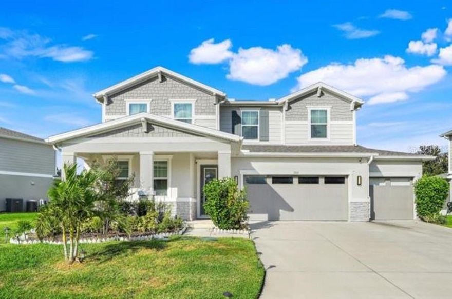 Welcome to this stunning 2023-built, 3,210 sq ft MULTI-GENERATIONAL home located in the highly sought-after Palisades community in Clermont. This thoughtfully designed home offers 4 BEDROOMS, 3.5 BATHROOMS, PLUS 2 BONUS ROOMS, and is perfectly positioned with front-facing POND and CONSERVATION views, a charming front porch, and a peaceful natural setting.

Step inside to a bright, open floor plan filled with natural light and modern finishes throughout. The heart of the home is the GOURMET KITCHEN featuring quartz countertops, stainless steel appliances, 42" upper cabinets, a BUTLER’S PANTRY, and a large center island that opens seamlessly to the family and dining areas — ideal for everyday living and entertaining.

The home includes a PRIVATE FIRST-FLOOR SUITE with a full bath, perfect for guests, extended family, or a home office. Upstairs, the spacious OWNER’S SUITE offers a spa-inspired bathroom and a large walk-in closet, along with two additional bedrooms (each with walk-in closets), a full bath, an OVERSIZED LOFT (ideal for a home office, gym, media room, flex space, or potential 5th bedroom), and a conveniently located laundry room.

Enjoy outdoor living with a covered patio in the backyard — perfect for relaxing or entertaining — and take in serene pond and conservation views from the inviting front porch.

Residents of Palisades enjoy RESORT-STYLE AMENITIES including a community pool, clubhouse, tennis, pickleball and basketball courts, lakefront playground, private boat ramp with access to Lake Minneola, golf cart trails, boating, fishing, and picnic areas. HOA dues include fiber-optic internet and basic cable.

Conveniently located just minutes from Historic Downtown Clermont, AdventHealth, shopping, dining, and with easy access to the Florida Turnpike — and an easy drive to Orlando, theme parks, and Florida’s beautiful beaches.

This home offers the perfect combination of space, flexibility, privacy, and lifestyle — truly a must-see!