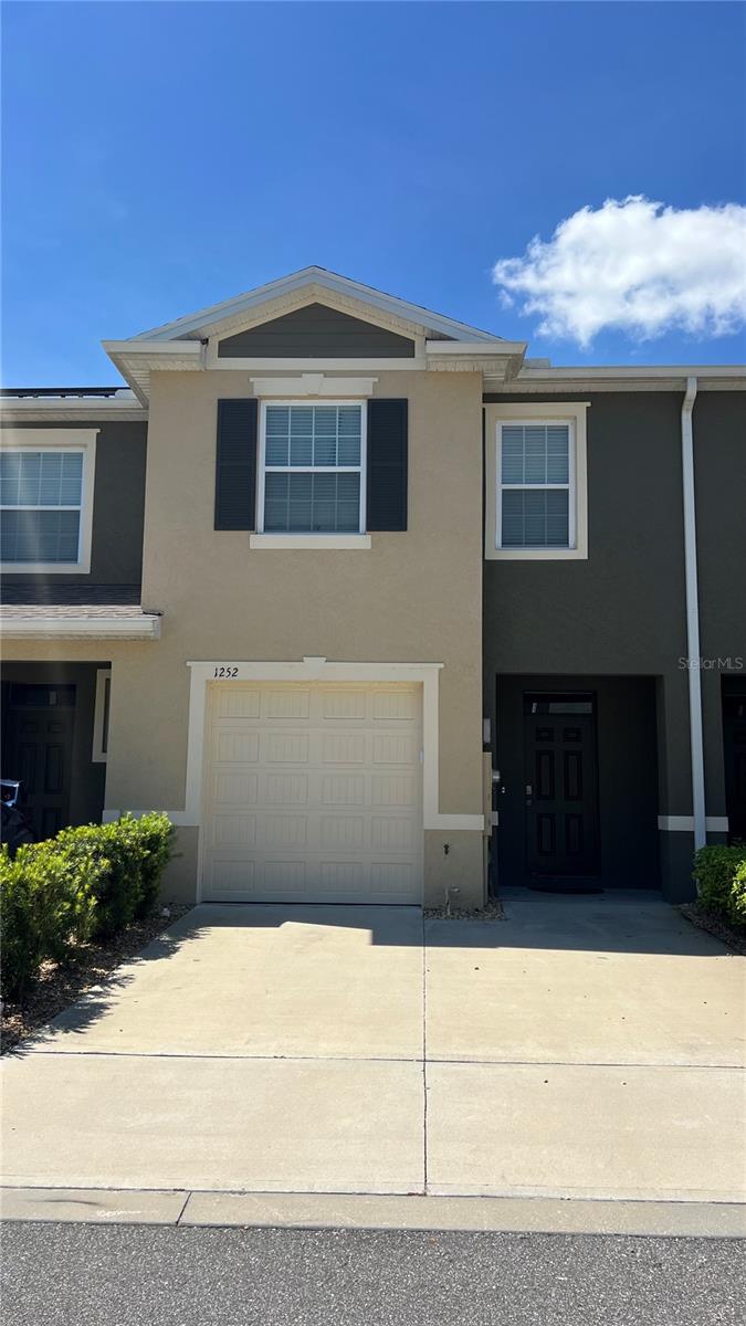 Investor Opportunity! this 3BR/2.5BA, 1,673 sqft townhome in Tria at Ridgewood Lakes offers modern living just off US-27, minutes from I-4, Posner Park, and Advent Health Medical Corridor. Features include an open floor plan, huge kitchen island, smart home tech, and triple-panel sliders leading to a spacious covered lanai. Upstairs, enjoy a large master suite with walk-in closet. Low HOA, 1-car garage, and 2-car driveway make it ideal for rental or personal use. Strong rental potential in a prime location! You won't find this price with these features anywhere else!