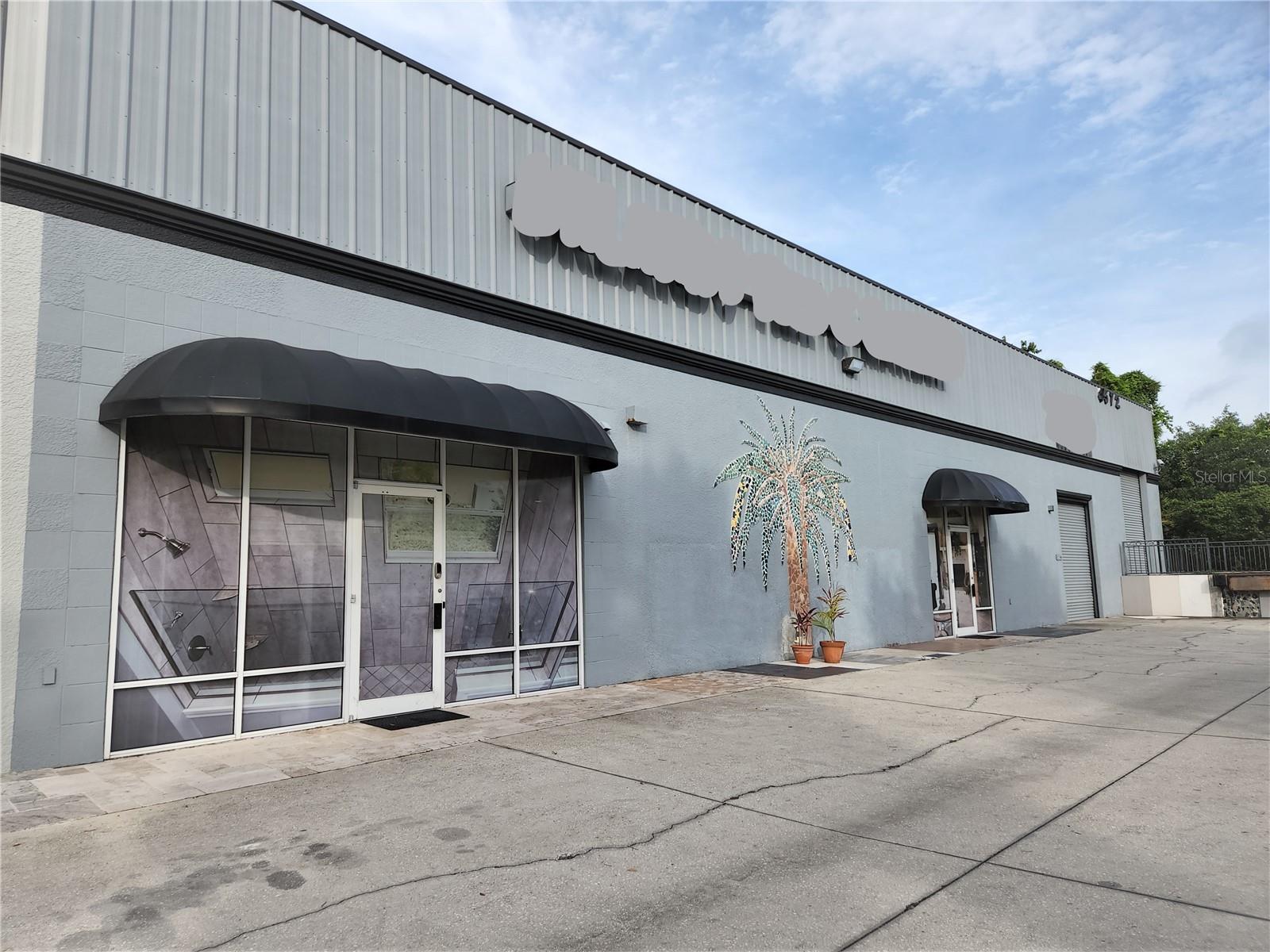 Location! Location! Location! PRICE REDUCTION, AI OFFICER AUTHORIZED THE NEW PRICE. WAREHOUSE building located in Winter Park with OFFICE and SHOWROOM space. ~ ZONED INDUSTRIAL with great exposure ~ Over 275 feet road frontage to high trafficked Palmetto Ave.(also known as Goldenrod Road) ~WAREHOUSE space is approx. 8,000 sq ft with 2 overhead doors, high loading dock, exhaust fans and mezzanine. ~ SHOWROOM/ WHOLESALE & RETAIL has approx. 3,500 sq. ft. a/c space with 2 OFFICES, 2 FULL BATHROOMS and a FULL KITCHEN. ~Selling BUILDING ONLY~ Business , inventory, furniture, autos, etc. do not convey.