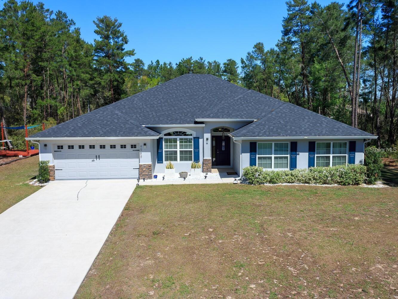 Great opportunity to purchase this well maintained house located in one of the most desirable neighborhoods on the SW Ocala. This home features 4 bedroom, 3 bathrooms, with a walk in shower on the second bathroom, a large pantry and very spacious indoor laundry room with 2 car garage, sitting on over 1/2 acre lot. It has a formal living and dining room, family room, breakfast nook, and ceramic tile in the kitchen, laundry and pantry area. This home features modern open floor plan concept with tall ceilings in the living areas, and split bedroom plan. Luxury lamps throughout the house. Solid wood cabinets and beautiful countertops with beveled edges throughout, and stainless steel appliances. A spacious counter height bar and a separate island. Spacious master bedroom has oversized walk in closet. The master bathroom has a linen closet, double sink vanity, a large tub and a separate shower. House also includes a water filtration system. Master bedroom also have dome ceilings with crown moldings. Walk out into the large covered lanai, plenty of space on the sides and backyard for outdoor entertainment and relaxation. Enjoy unforgettable afternoons with friends and or loved ones on the deck and picnic area located in the backyard. Close distance to I-75 and SR-200 where you will find restaurants, banks, Shopping centers, medical offices, supermarkets, World Equestrian Center, Rainbow River and Silver Springs A MUST SEE FOR SURE!!