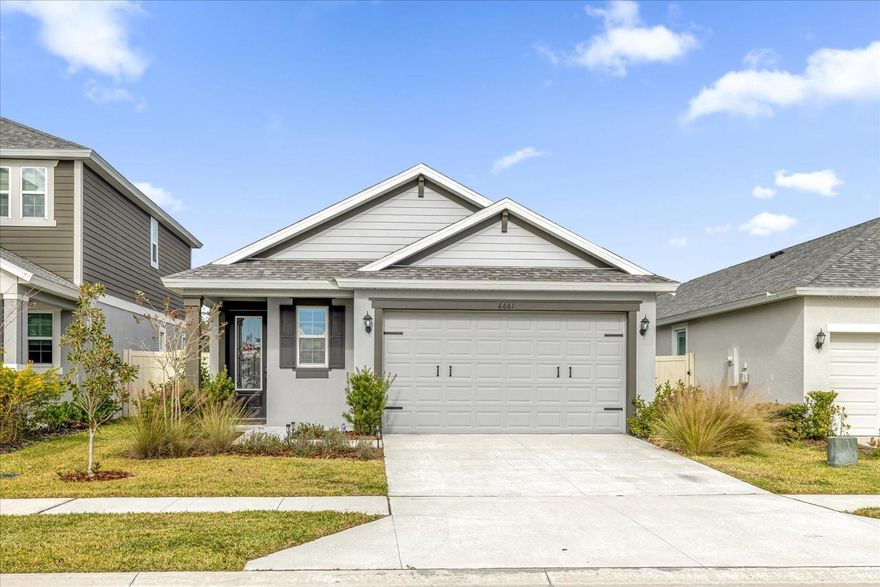 Built in 2023 and immaculate throughout, this charming home is nestled on a quiet interior lot in the desirable Villages of Bridgewater, offering peaceful water views from both the front and backyard. Designed with an open floor plan and filled with natural light, the home features tall ceilings, large windows, and sliding glass doors that create a bright, welcoming atmosphere.

Enjoy solid flooring throughout for easy maintenance, neutral paint, and tasteful molding and millwork that add character and style. A well-sized dedicated office provides the perfect space for working from home, studying, or managing daily tasks. The well-appointed island kitchen is a standout with quartz countertops, designer backsplash, custom cabinetry with ample storage, and a walk-in pantry, all opening seamlessly to the spacious dining area and living room—ideal for everyday living and entertaining.

Retreat to the primary bedroom with a private ensuite bath and walk-in closet, while two additional bedrooms offer generous closet space for family or guests. Step outside to a spacious screened-in lanai overlooking a fully fenced backyard with plenty of green space for pets and play—and no rear neighbors for added privacy.

This swim community offers outstanding amenities including a clubhouse, pool, playground, tennis courts, and a dock for fishing, making it fun for the whole family. The low monthly HOA includes both cable and internet. Ideally located with easy access to Polk Parkway and I-4, plus nearby shopping and dining, this move-in-ready home combines comfort, convenience, and community living at its best.