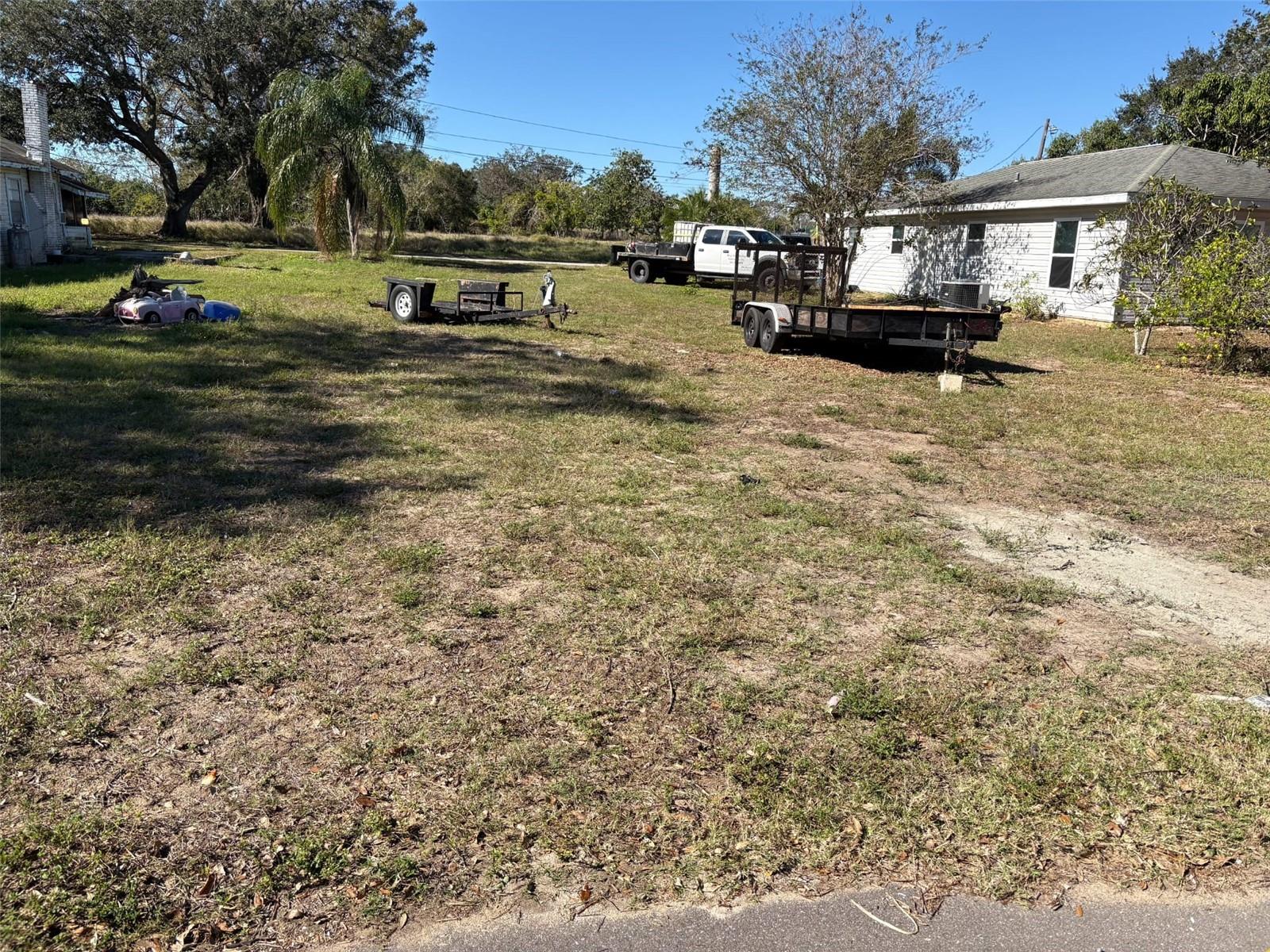 This prime vacant lot in the heart of Frostproof is your blank canvas, ready for you to create the home or investment property of your dreams. With a central location and a peaceful ambiance, this lot offers a world of potential. Located in a quiet neighborhood just moments from downtown Frostproof, offering small-town charm with modern conveniences close by. Perfectly positioned for lovers of fishing, boating and more since it is just a short drive from parks, lakes and recreational spots. Great location near US 27 and US 98 with Frostproof Middle School and Frostproof High School in close proximity. Purchase price includes an additional Parcel located on the rear part of 811 North Ave with the address 816 Lime Ave, Frostproof and Legal Description CARSONS ADD PB 7 PG 8 IN SEC 33 T31 R28 BLK B LOTS 19 & 20 LESS W 79 FT THEREOF. Seller is looking to sell the two lots together and will not be sold separately. The parcels tax IDs are 28-31-33-977200-002191 and 28-31-33-977200-002192.