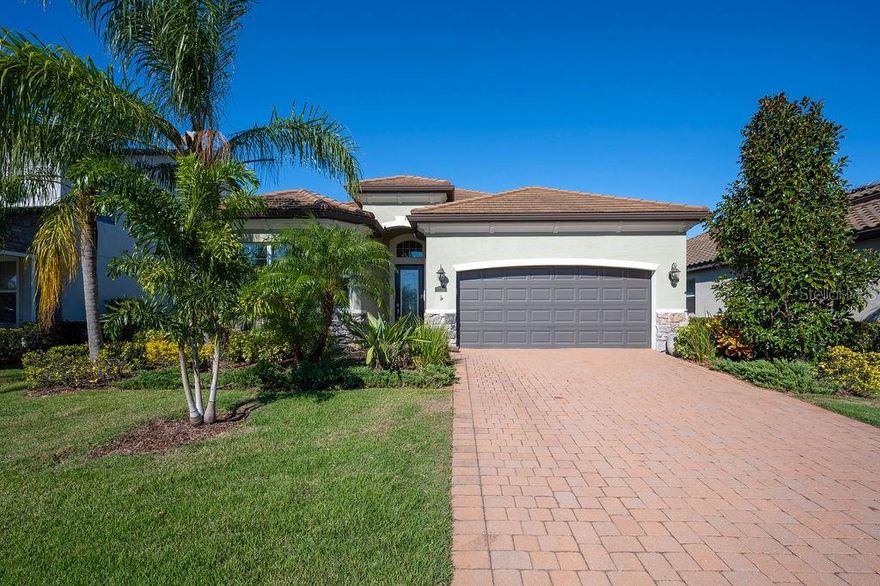 Welcome to this pristine, designer-inspired home in the gated community of Arbor Grande in Lakewood Ranch. This elegant 3-bedroom, 2-bath home with a versatile den is the perfect blend of luxury and functionality—offering top-tier upgrades and peace of mind features throughout in a flood zone X!!!
Enjoy the benefit of a 3.21% assumable mortgage, making this an extraordinary opportunity in today’s market.
Step inside to discover a light-filled, open-concept floorplan with tile and carpet flooring, soaring ceilings, and a stunning flow for entertaining. The chef’s kitchen is a showstopper, showcasing granite countertops, a Bosch ultra-quiet stainless steel dishwasher, premium appliances, ample cabinetry, and a spacious island with upgraded Crate & Barrel hammered antique pewter/brass metal down pendants—each retailing at $400.
Throughout the home, you’ll find over $8,000 in upgraded lighting fixtures, all Alexa- and Siri-compatible, including:
A dramatic oversized Arhaus Geode brass chandelier in the family room ($2,150 retail)
A Arhaus La Cage rectangular antique brass chandelier in the dining room ($2,999 retail)
A sleek West Elm perforated circular LED chandelier in the primary suite ($500 retail)
Additional upgraded lighting in the office, entry, and guest bedrooms
The home also features a new condenser (under warranty), and the tile roof has weathered multiple hurricanes without leaks—a true testament to quality construction. Sitting on one of the highest elevation lots in the neighborhood, this property has remained safe from street flooding year after year.
Step outside to your serene screened-in lanai and enjoy Florida living at its finest. The entire backyard is enclosed with a premium black aluminum gated fence—an $8,000 upgrade that adds both beauty and security.
This meticulously maintained home in Arbor Grande also gives you access to resort-style amenities, including a sparkling pool, clubhouse, fitness center, and community events that foster connection and lifestyle.