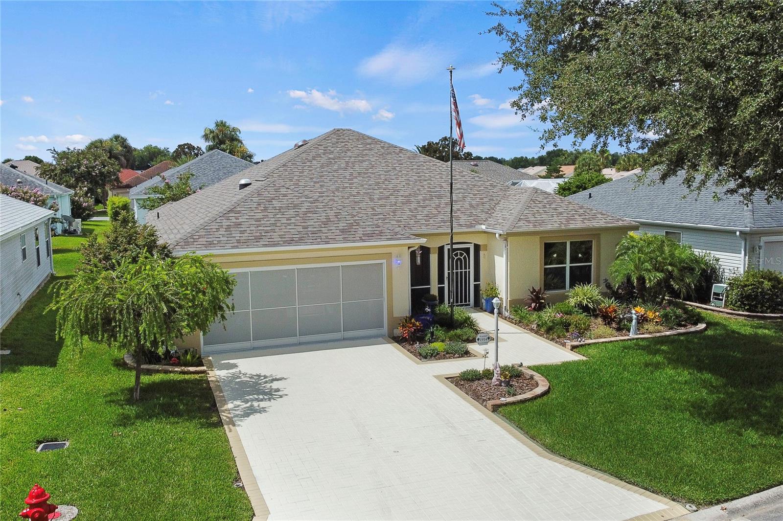 No Bond on this Beautiful La Costa Model Home. This 2 Bedroom 2 Bath home also has a versatile flex room complete with a Murphy bed and closet. Home Features: New Roof July 2024, Water Heater 2024, Ceramic Tile Plank flooring in the bedrooms, kitchen, and bathrooms, with tile throughout the rest, ensuring a carpet-free environment. Natural light pours in through three strategically placed solar tubes. The inviting foyer, which includes a rare coat closet, opens to a spacious dining and living room combination, perfect for entertaining. The gourmet kitchen showcases custom wood countertops, stainless steel appliances, an eat-in area with custom cabinetry, a serving bar, and a breakfast bar for casual dining. Outdoor living is just as inviting, with small river rock flooring on both the front porch and rear lanai, creating a charming space to relax. The exterior, driveway, and back patio have been freshly painted, and the garage is equipped with 220V for hobbyists. All ducts have been recently cleaned and sanitized, and the home comes with a one-year home warranty for added peace of mind. This home has been meticulously maintained and is ready for its new owner. Call me today for a private showing or FaceTime if not local.