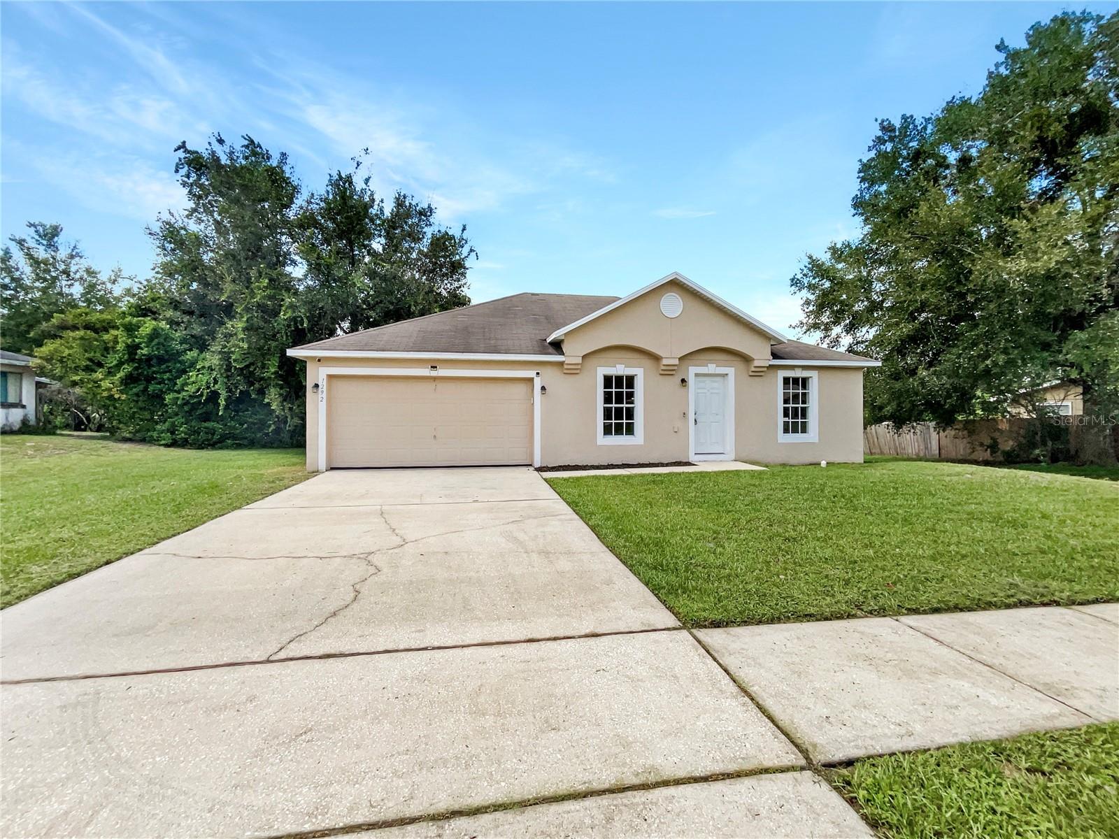 One or more photo(s) has been virtually staged. Beautifully Maintained Deltona Home – Move-In Ready!
This 3-bedroom, 2-bathroom residence with a 2-car garage offers an open split-bedroom floor plan with vaulted ceilings and neutral paint throughout.
The kitchen features a full breakfast bar and attached dining area, perfect for everyday meals or entertaining. Durable ceramic tile flooring flows seamlessly through the entire home for easy maintenance.
The spacious primary suite includes a walk-in closet and private ensuite bath, while the split layout provides privacy for secondary bedrooms.
Step outside to a large deck and good-sized backyard — perfect for gatherings, play, or simply enjoying the outdoors.
Located in a family-friendly neighborhood with NO HOA, you’ll enjoy the freedom to make this home your own. Conveniently situated just minutes from I-4, shopping, dining, hospitals, and public transportation, and only 2 miles from Lake Gleason, this home combines comfort and location in one!