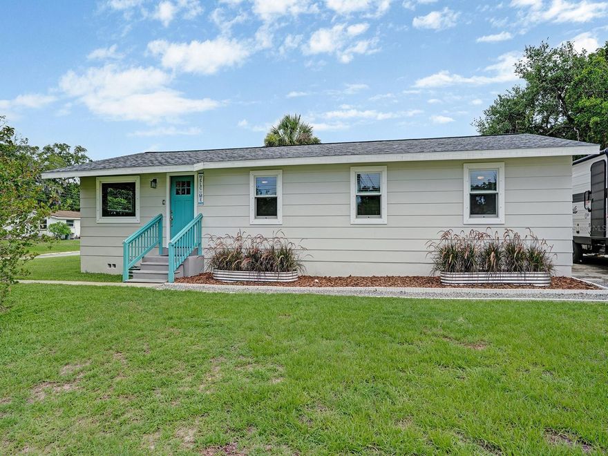 Completely renovated from top to bottom and move-in ready, this beautifully updated home is situated on a desirable corner lot at the end of a quiet street and has never flooded! Extensive improvements provide peace of mind, including a new roof, new plumbing, new electrical system, new subfloor, new flooring, new trim, new interior doors, new Anderson windows, and beautifully updated bathrooms. The stunning kitchen has been completely remodeled with maple soft-close drawers, butcher block countertops, and high-end Samsung appliances, creating a warm and inviting space for cooking and entertaining. Additional upgrades include a new tankless water heater and a well-maintained 2016 AC system. Outside, you'll find a fully fenced backyard with a new deck, outdoor shower, and a 2023 shed equipped with electricity and a roll-up door, offering excellent storage or workshop space. RV owners will appreciate the convenient 50-amp hookup, while hurricane shutters provide added protection during storm season. The home also features durable cement board siding and a solid concrete foundation. Ideally located just minutes from downtown, you'll enjoy easy access to a variety of dining, shopping, entertainment, and community events while still enjoying the privacy of a quiet location. With quality upgrades throughout, exceptional outdoor amenities, and a prime location, this home is truly ready for its next owner to enjoy.
