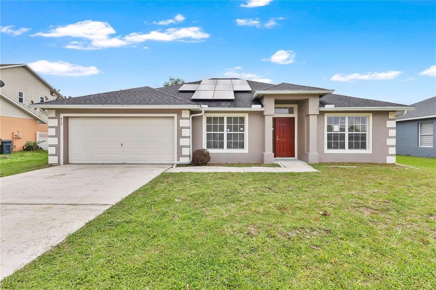 Positioned in the desirable Poinciana Villages community, this 3-bedroom, 2-bathroom home offers a functional layout, energy efficiency with solar panels that are paid off, and bright living spaces throughout. As you step inside, you’re welcomed by two identical front rooms located on either side of the entryway—perfect for a home office, playroom, flex space, sitting area, or additional living space to fit your needs.

The heart of the home features an open-concept design where the living room, dining area, and kitchen flow seamlessly together for everyday convenience and entertaining. The kitchen comes complete with all appliances, plenty of cabinet and counter space, tile backsplash, a spacious walk-in pantry, and a wrap-around bar-style counter with seating. Overlooking the living room, the space is filled with natural light pouring in through large double sliding glass doors.

Privately located just off the living room, the primary suite offers a bright and relaxing retreat with an attached ensuite bathroom featuring dual vanity sinks, a large garden tub, spacious tile walk-in shower, and an oversized walk-in closet with plenty of room for two. The additional bedrooms are tucked down a separate hallway on the opposite side of the home, similar in size and layout, and filled with natural lighting.

Step outside to a wide-open backyard with plenty of space for family gatherings, entertaining, pets, or simply enjoying the outdoors. Conveniently located near major roads, highways, shopping, dining, entertainment, and more, this home combines comfort, space, and convenience all in one.