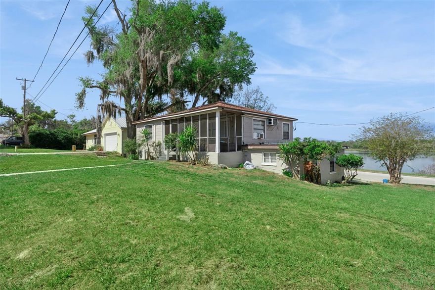 Rare opportunity to acquire a lakefront property in one of Groveland’s most rapidly improving areas. Situated directly across from the lake and just steps from a beautifully maintained city park, this property offers strong upside potential for investors or buyers looking to create a customized waterfront residence. The home features a flexible two-level layout with separate living areas, including an upper level with 2 bedrooms, 1 bathroom, and kitchen, and a lower level with 3 bedrooms and 1 bathroom—ideal for multi-generational living, rental income, or creative repositioning. Surrounded by renovated homes and ongoing neighborhood improvements, this is a location-driven investment with long-term value. The property requires updates, including HVAC, windows, and interior renovations, and is being sold as-is. Currently tenant-occupied on a month-to-month basis. Showings by appointment only.