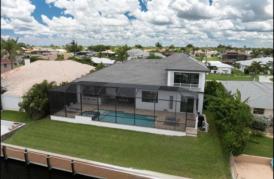 HUGE PRICE REDUCTION $ 4000,000.00,  IT IS THE MOST REPRESENTATIVE VILLA…

YOU CANNOT BEAT THIS….1 AAA LOCATION.. DESIGNED AND FULLY FURNISHED  BY "LEILI" FOR $700,000,00, EXCLUSIVELY WITH HIGH-END DESIGNER FURNISHINGS. 

2 MINUTES DIRECT ACCESS TO THE GULF.. NO BRIDGES. 

COMPLETELY DESIGNED BY "LEILI" USING ONLY HIGH END FURNITURE.

With incredible attention to detail result in an unbeatable USP, built by "FREY AND SON" guaranteeing high end quality. 

New covered boat dock with a new lift build by "STOKES MARINE" with a very very large Tiki platform, of course equipped with electrical connections and water connection to optimally maintain your boat. 

A captain's walkway is provided with a special surface. 

Experience refined coastal luxury in this exceptional waterfront home, where exquisite craftsmanship and thoughtful design create a seamless blend of elegance, comfort, and indoor-outdoor living. 

This residence boasts a stylish oversized adventure Pool with privat Spa with tranquil waterfall.

Surrounded by lush, meticulously landscaped grounds that enhance both privacy and beauty. 

The oversized lanai serves as a true outdoor retreat, featuring a welcoming dining area and a spacious professional outdoor kitchen with Coyote Grill, Flame, extractor hood, wine fridge and air-conditioned drawers, designer outdoor bar chairs. 

Dining table area outside luxurious seating making it ideal for both quiet mornings and great parties with your friends at night.

Disappearing sliders doors connect the great room to the outdoors, creating a harmonious transition between interior and exterior living spaces. 

Inside, the kitchen offers elegant cabinetry, sleek granite countertops, stainless steel appliances, and a spacious granite island. 

A charming dining area overlooks the pool, the lanai and the Water, adding to the home's inviting ambiance. 

A walk-in pantry provides additional storage and functionality. 

The open-concept design ensures a natural flow between the kitchen, dining area, and great room, where designer lighting and elegant finishes add a touch of sophistication. 

The office provides a quiet ambience for relaxed work, if you want.

The primary suite is a private sanctuary, featuring walk-in closet and a spa-inspired bath with a luxurious shower, deep soaking designer tub, and dual vanities. 

A glass-paned door opens directly to the lanai, allowing for effortless indoor-outdoor living. 

A spacious three-car garage with built-in storage provides ample space for vehicles and equipment. 

This home is truly turnkey—FULLY FURNISHED and ready to move in, not forgetting the professionally furnished private fitness room equipped with the best sporting equipment. 

And also not to forget a special feature: all windows are blackout with custom-made blinds from "Hunter Douglas" and are individually electrically adjustable. They not only ensure your privacy but also protect you from excessive sunlight.

For your safety, the entire lanai features a hurricane-proof electric screen, which is also operated by remote control. Pure comfort, unbeatable.

of course hurricane-resistant glass is used for windows and doors.

Conveniently located just minutes from world-renowned beaches and many championship golf courses, as well as many restaurants and the finest shopping. 

Simply unlock the door and start living in paradise. Everything is there; you don't need to organize anything.