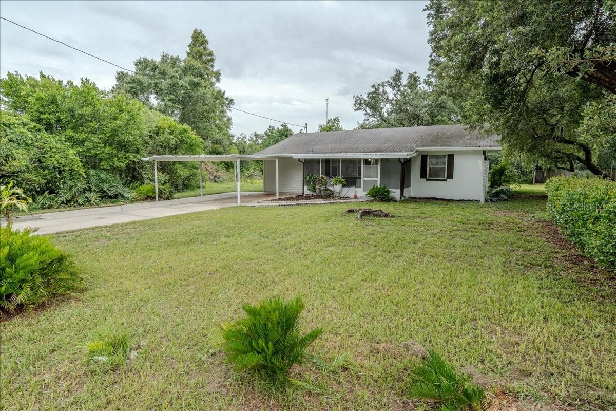 Don't Miss This One! Excellent opportunity for first time homebuyer or investor, perfectly located in the heart of Lakeland. This home is ideal BLOCK HOUSE for modern living and entertaining. No detail has been overlooked in this stylish renovation—everything from the new luxury vinyl plank flooring throughout to the high-end finishes in the kitchen and bathrooms will make you feel right at home. This is fully beautifully Remodeled Lakeland house that retains its original charm! NO HOA! This is spacious single-family home sits on a large lot and features BRAND-NEW AC , new Doors, remodeled bathrooms, new kitchen Cabinets, Stainless Steel Appliances, Granite Countertops, new Luxury Vinyl Flooring, New ceiling fans with lights throughout the whole house, and many more. The interior, exterior, and ceilings have been freshly painted. Additional highlights include a wide carport, a large front porch, and new epoxy flooring on the porch and laundry room. When you visit, be sure to step outside to enjoy the expansive backyard, perfect for entertainment. Located just 4 minutes from Southeastern University and 2 minutes from the Lake Bonny boat ramp, the property is also close to the Lake-to-Lake Trail, offering 26 miles of paths connecting numerous lakes. Ideally located in Central Florida, close to parks and shopping, and less than an hour from major theme parks and attractions. This property is a must-see to truly appreciate its beauty and all the enhancements. Listing agent is also an owner. PASSED 4 POINTS INSPECTION! Call and visit today! Easy Showing!