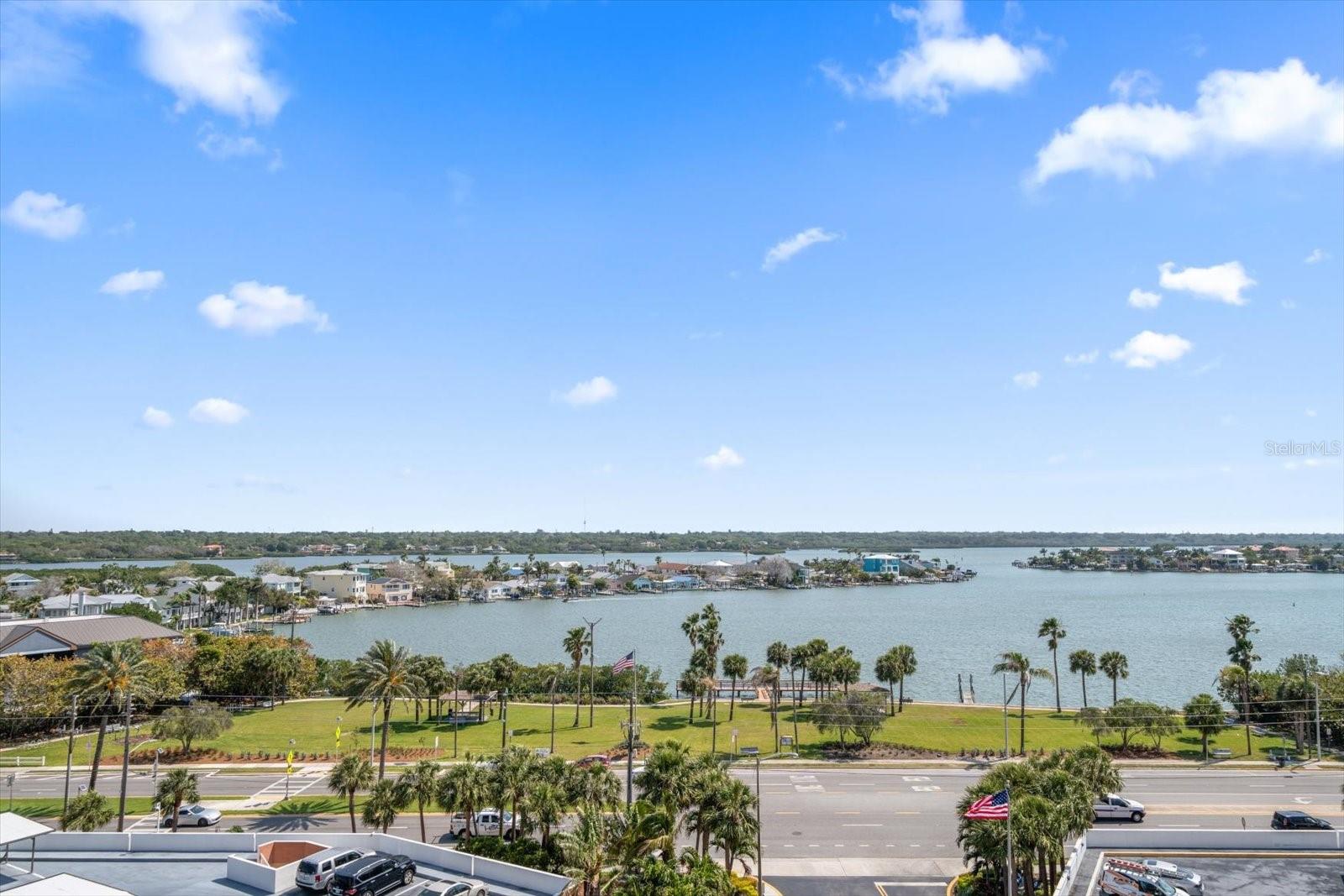 Marvel at the breathtaking vistas of the Intracoastal waterway, the skylines of St. Pete and Tampa, and glimpses of the Gulf! This meticulously updated 2 bedroom, 2 bathroom condo boasts new luxury plank and porcelain tile flooring, along with elegant 5" baseboards. The open kitchen showcases exquisite honed Montecristo Quartzsite countertops, a huge island and bar seating, Kraftmaid custom cabinets, and translucent phantom grey Kitchen Aid appliances. The bathrooms exude luxury with polished marble finishes, glass-enclosed showers, and custom Robern mirror medicine cabinets. Recent upgrades include a brand new 50-gallon water heater and an approximately 5-year-old A/C unit. Situated within the prestigious Redington Towers community, residents enjoy access to a Gulf-front swimming pool, an on-site gym, and outdoor BBQ facilities. Covered and assigned parking complete with electric vehicle charging stations, provides convenience, while a storage closet and 24-hour security guard offer peace of mind. Delight in the proximity to numerous restaurants and shops, with the serene Del Bello Park just across Gulf Boulevard. For endless relaxation, the white sandy beach is mere steps away, beckoning you for year-round enjoyment. With an array of amenities and unparalleled surroundings, this condo offers the opportunity to live where others vacation!